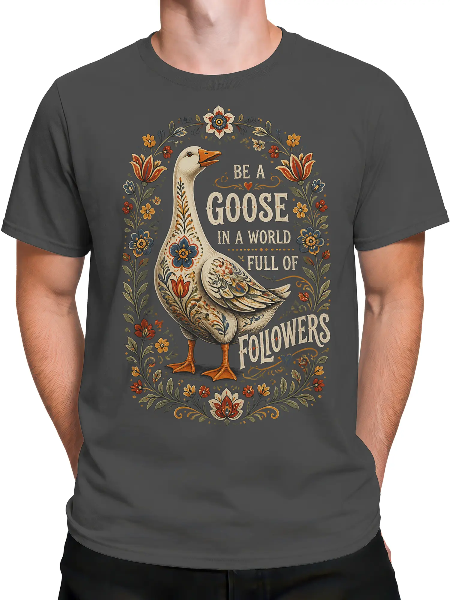 Male torso wearing a gray goose T-shirt with vintage floral artwork and a rebel message