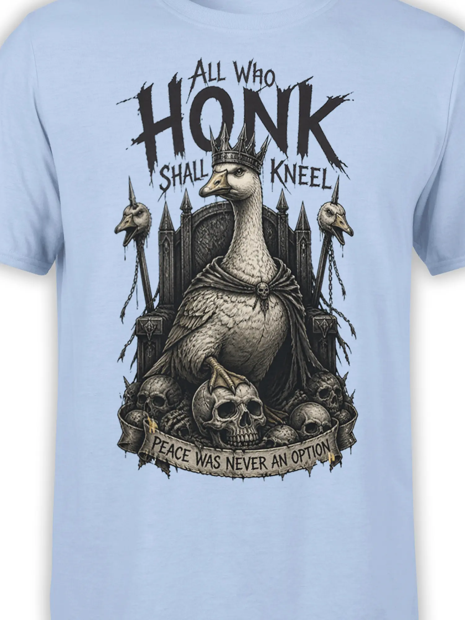 Close-up of crowned goose artwork with gothic throne, skulls, chains, and honk-themed text on light blue fabric