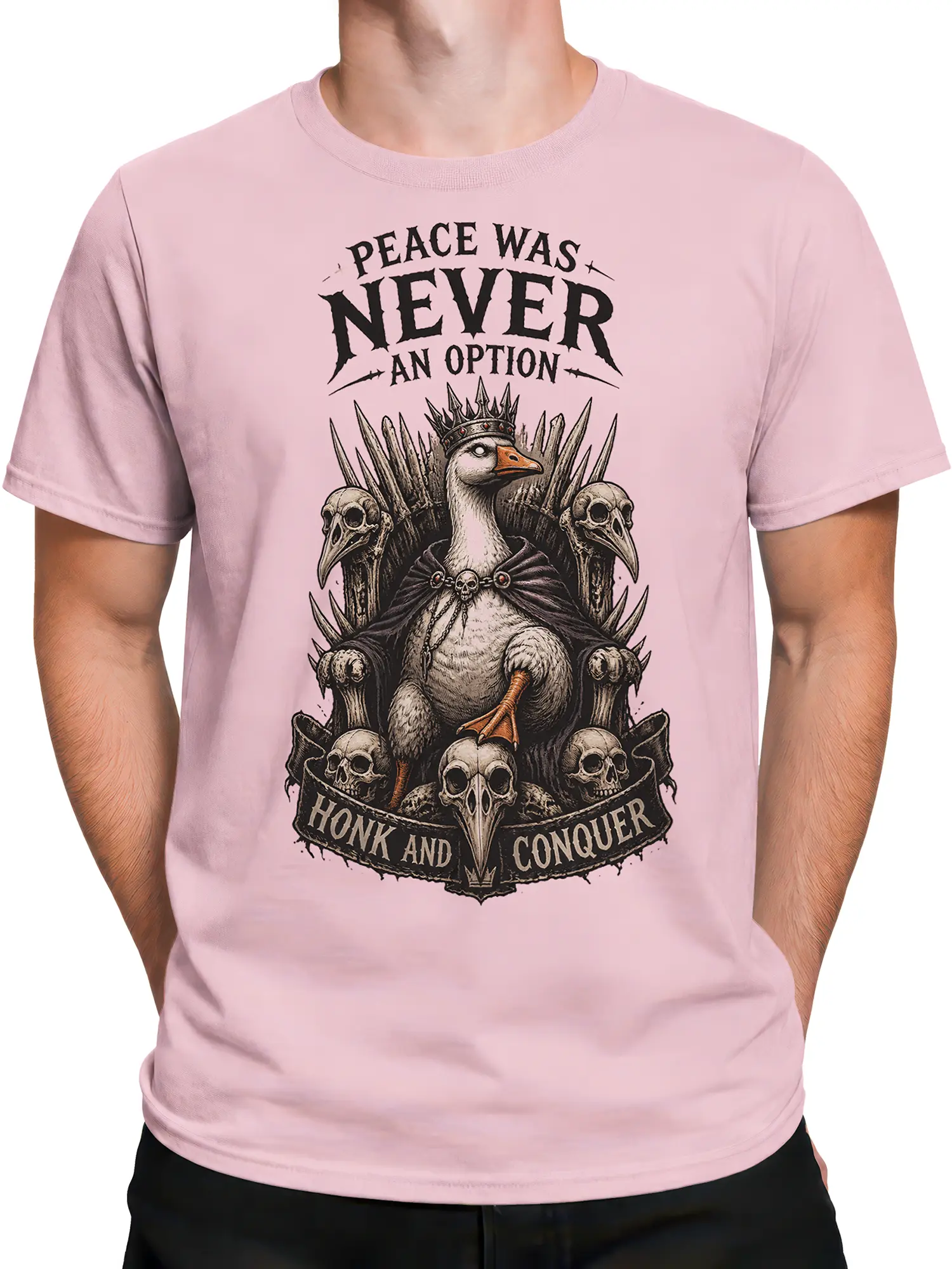 Male torso wearing a pink T-shirt with crowned goose-like bird and skull throne graphic