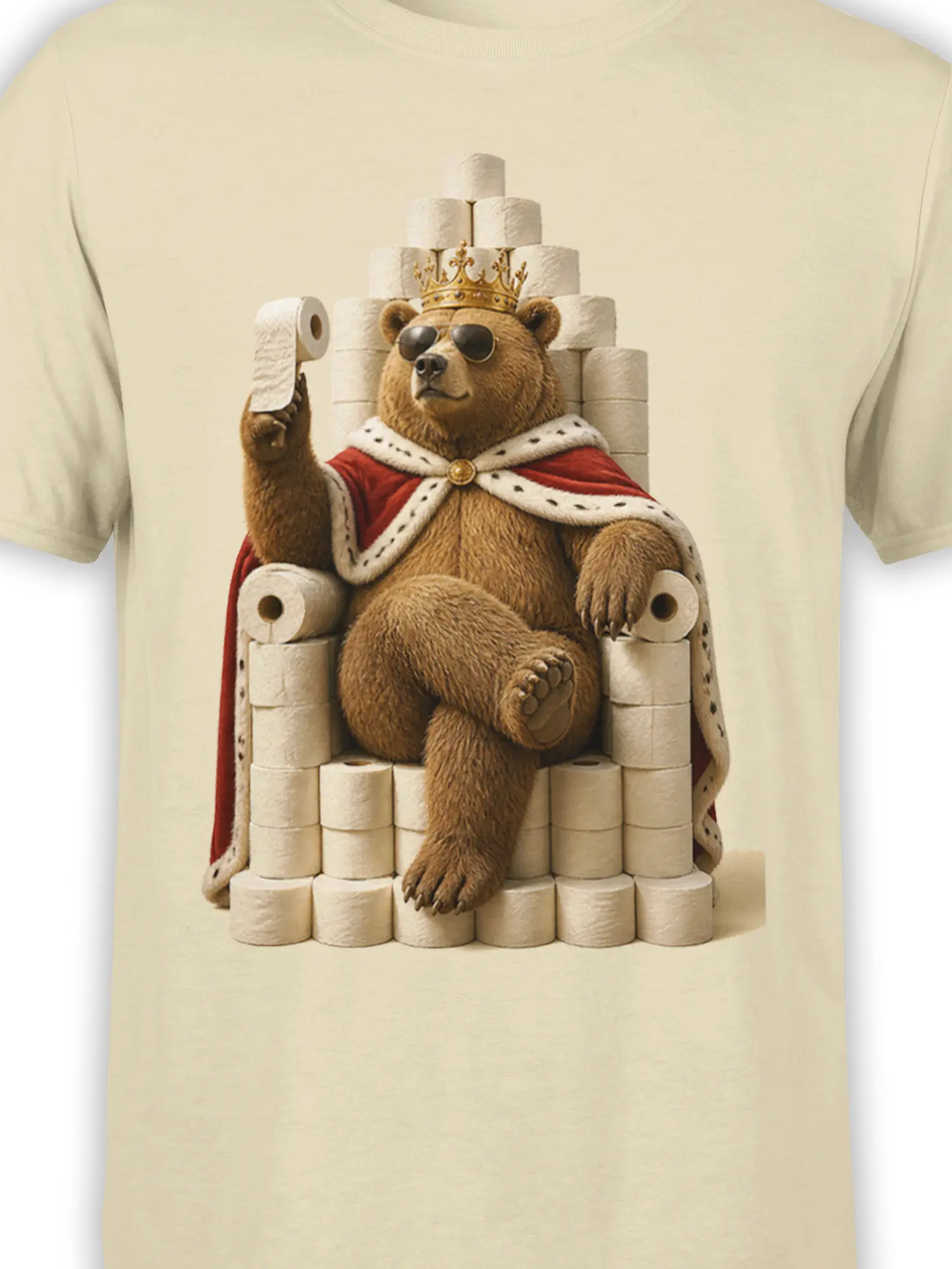Close-up of crowned bear graphic with sunglasses, red cape, and toilet paper throne on beige fabric