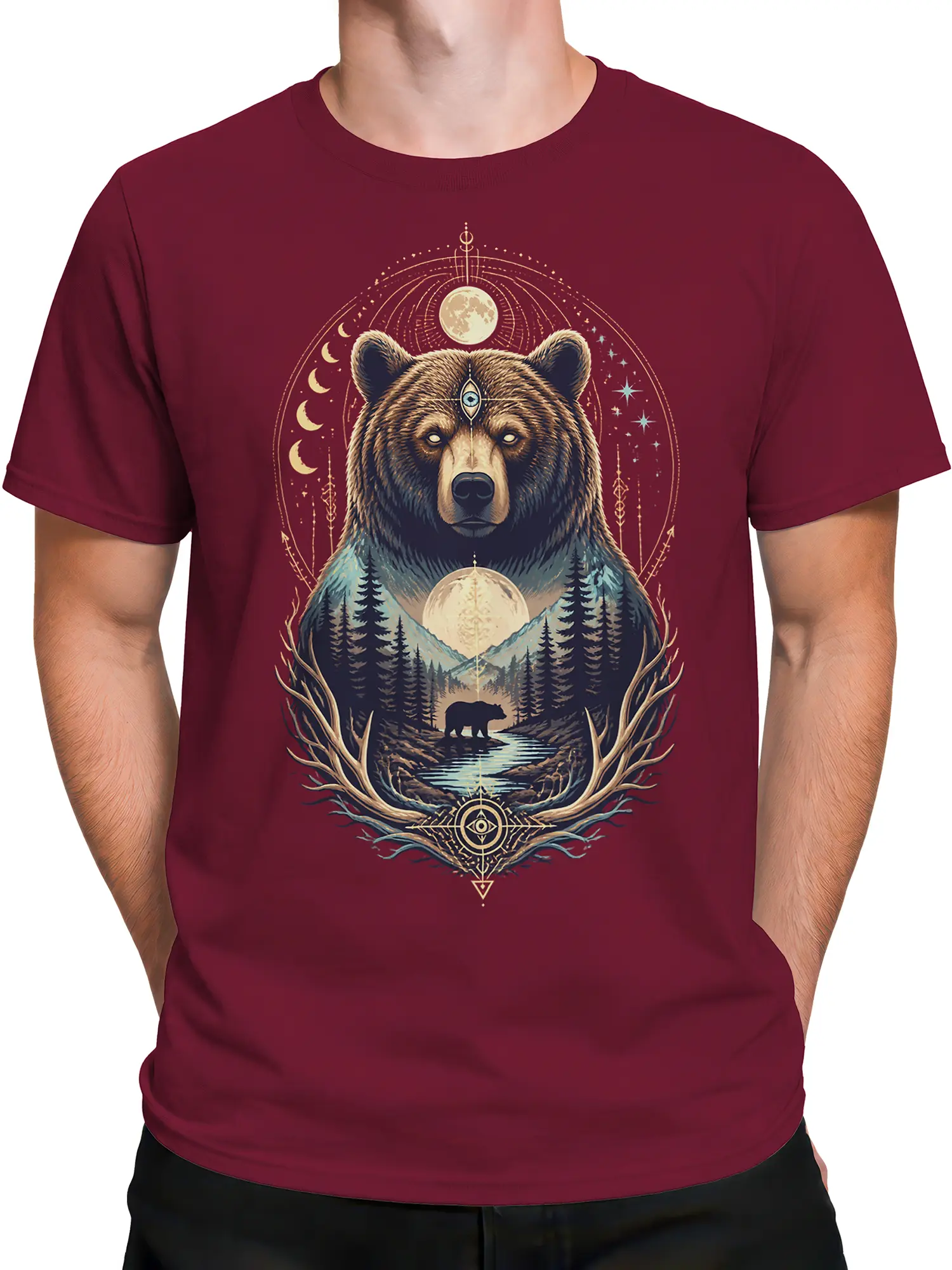 Male torso wearing a burgundy bear T-shirt with celestial symbols, mountains, forest, and a reflective woodland stream