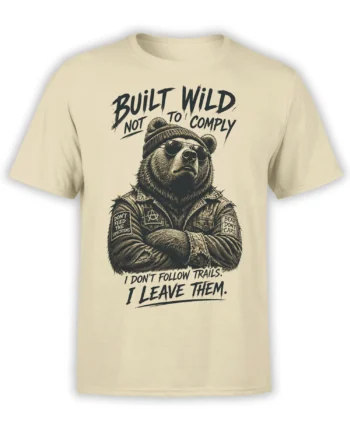 Beige bear t-shirt with sunglasses, knit beanie, patched vest, and bold Built Wild Not to Comply lettering
