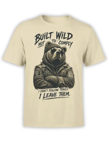 Beige bear t-shirt with sunglasses, knit beanie, patched vest, and bold Built Wild Not to Comply lettering