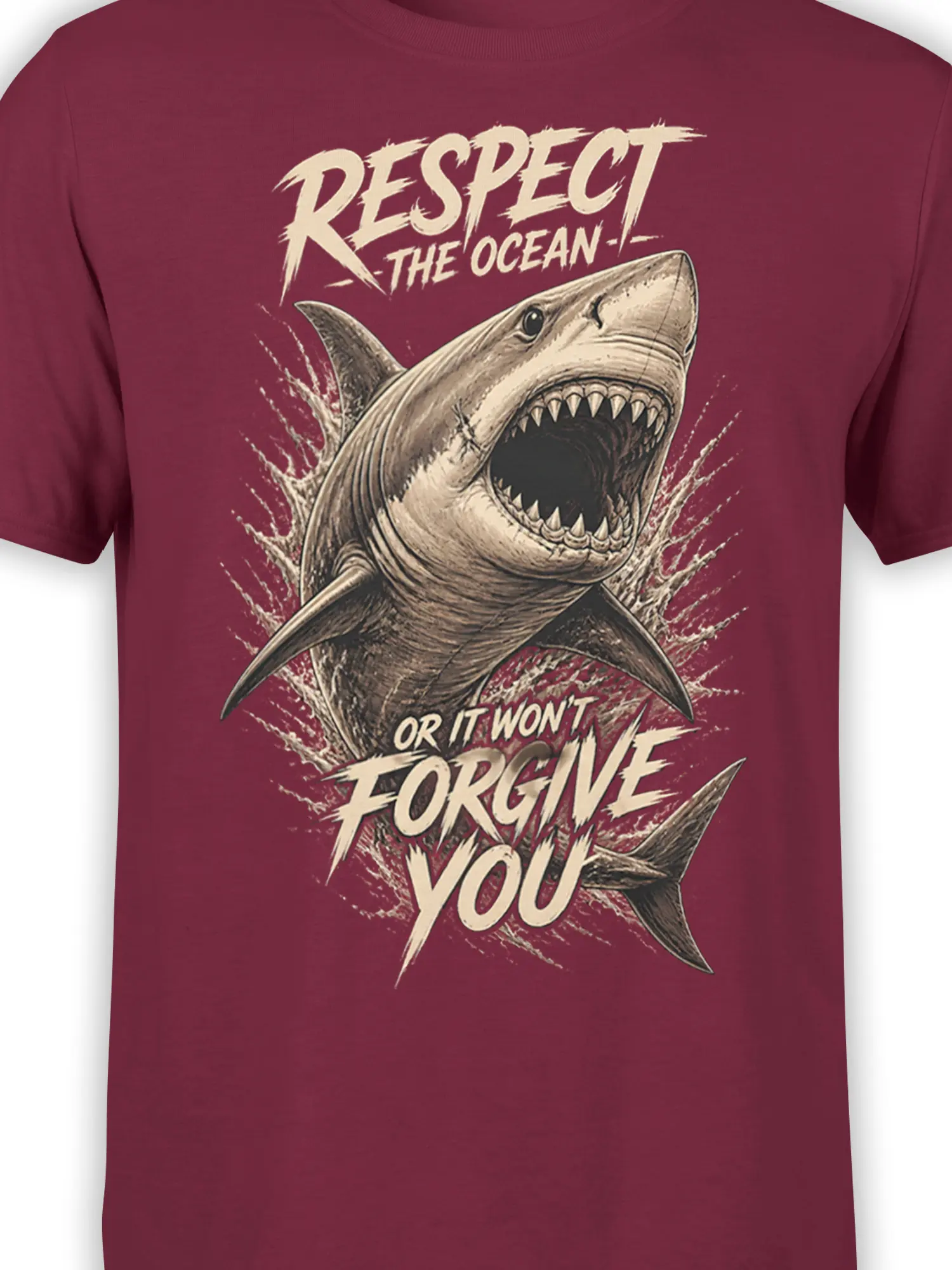 Close-up of shark teeth, ocean waves, and distressed lettering on a burgundy shark T-shirt
