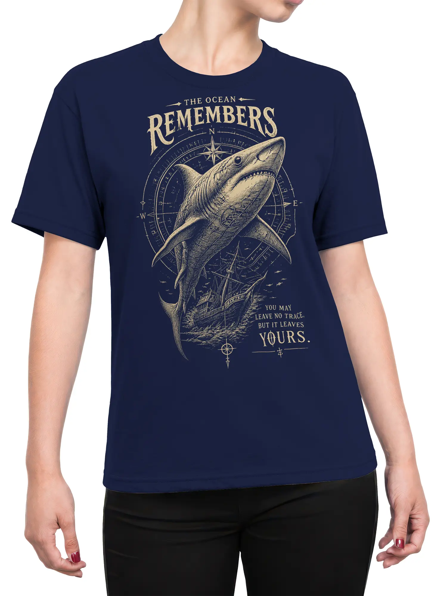Female torso wearing a navy shark T-shirt with compass and sailing ship artwork