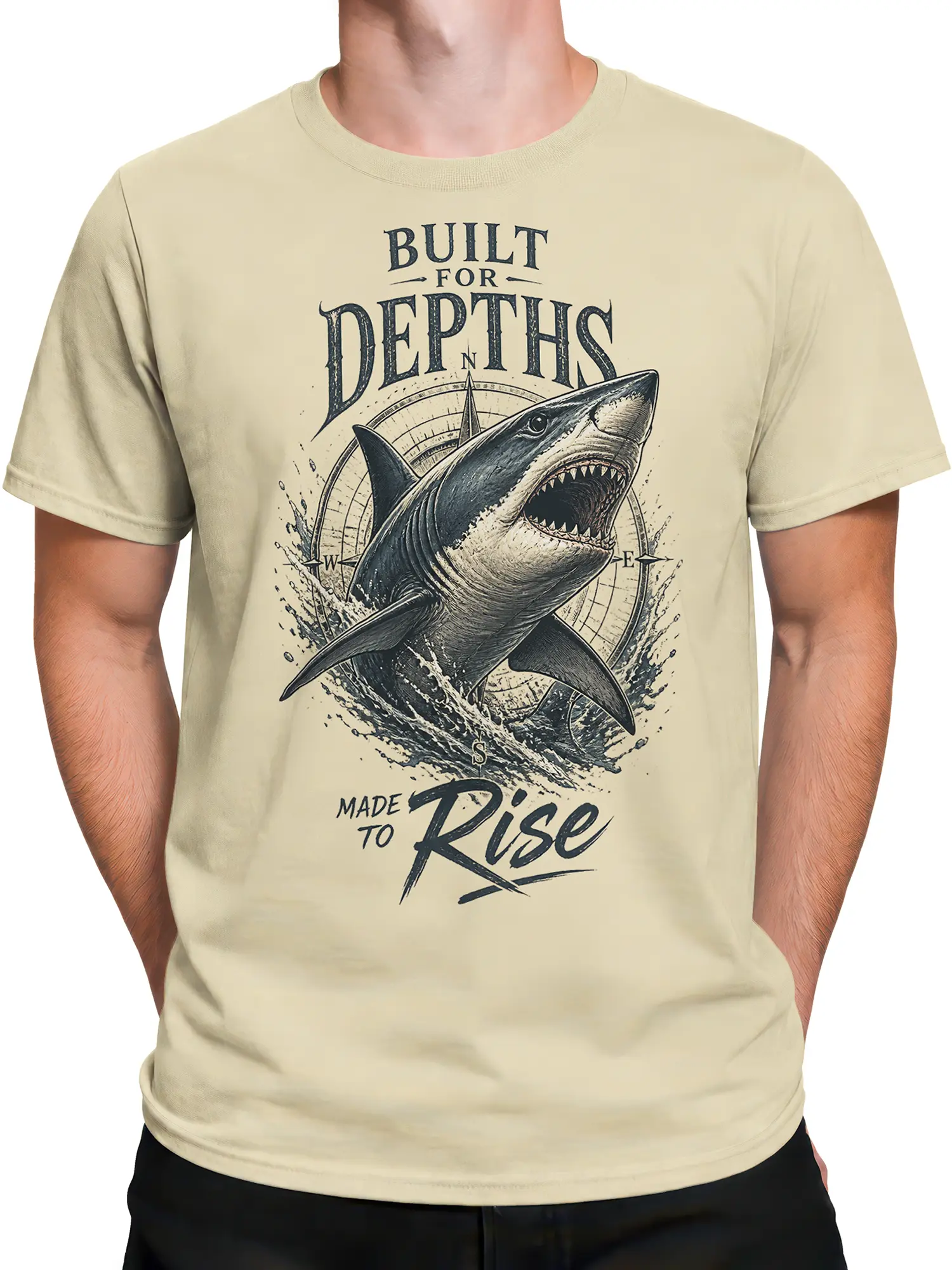 Male torso wearing a beige vintage shark T-shirt with nautical compass artwork