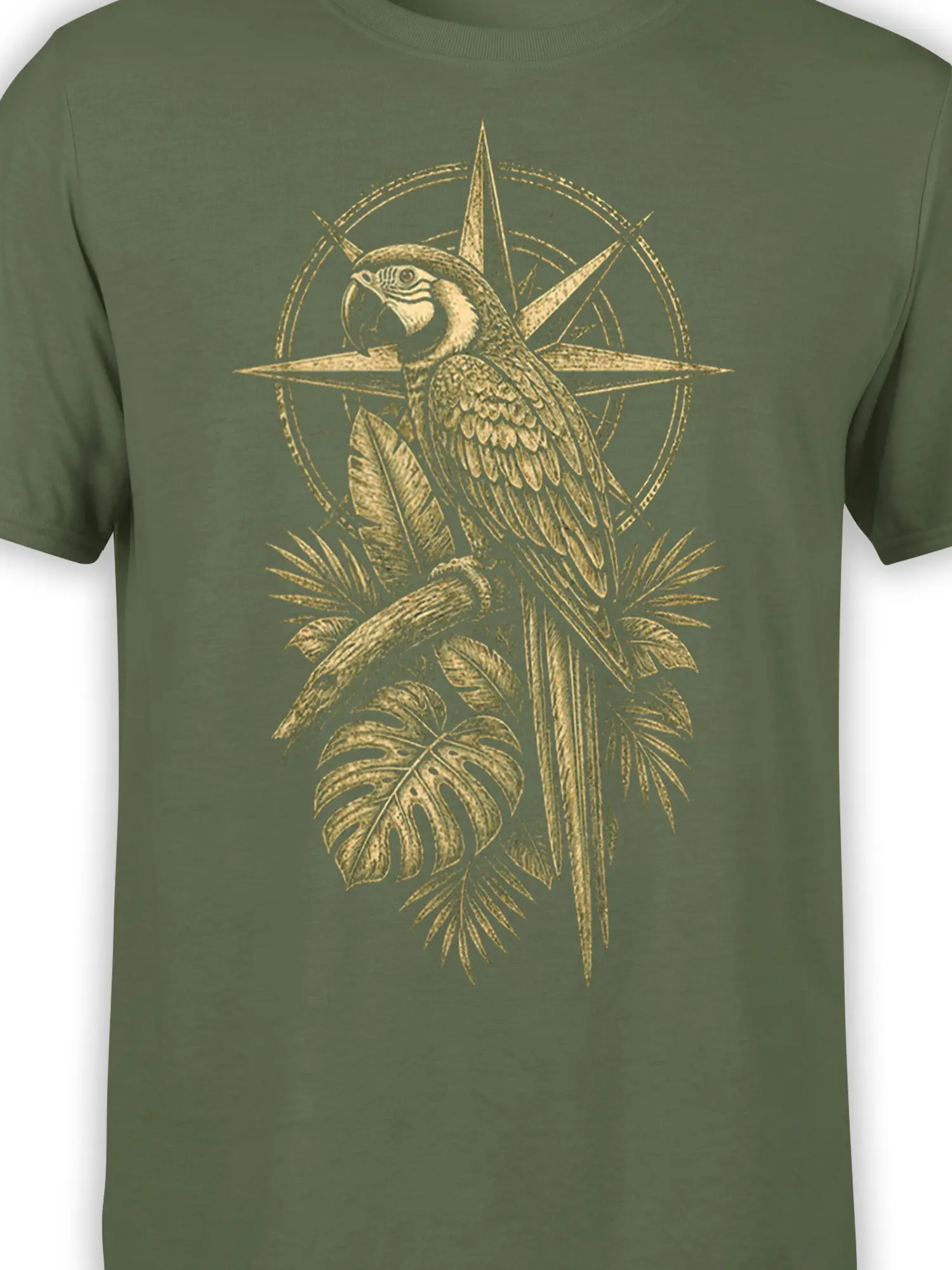 Close-up of vintage parrot artwork, tropical leaves, and compass star on an olive T-shirt