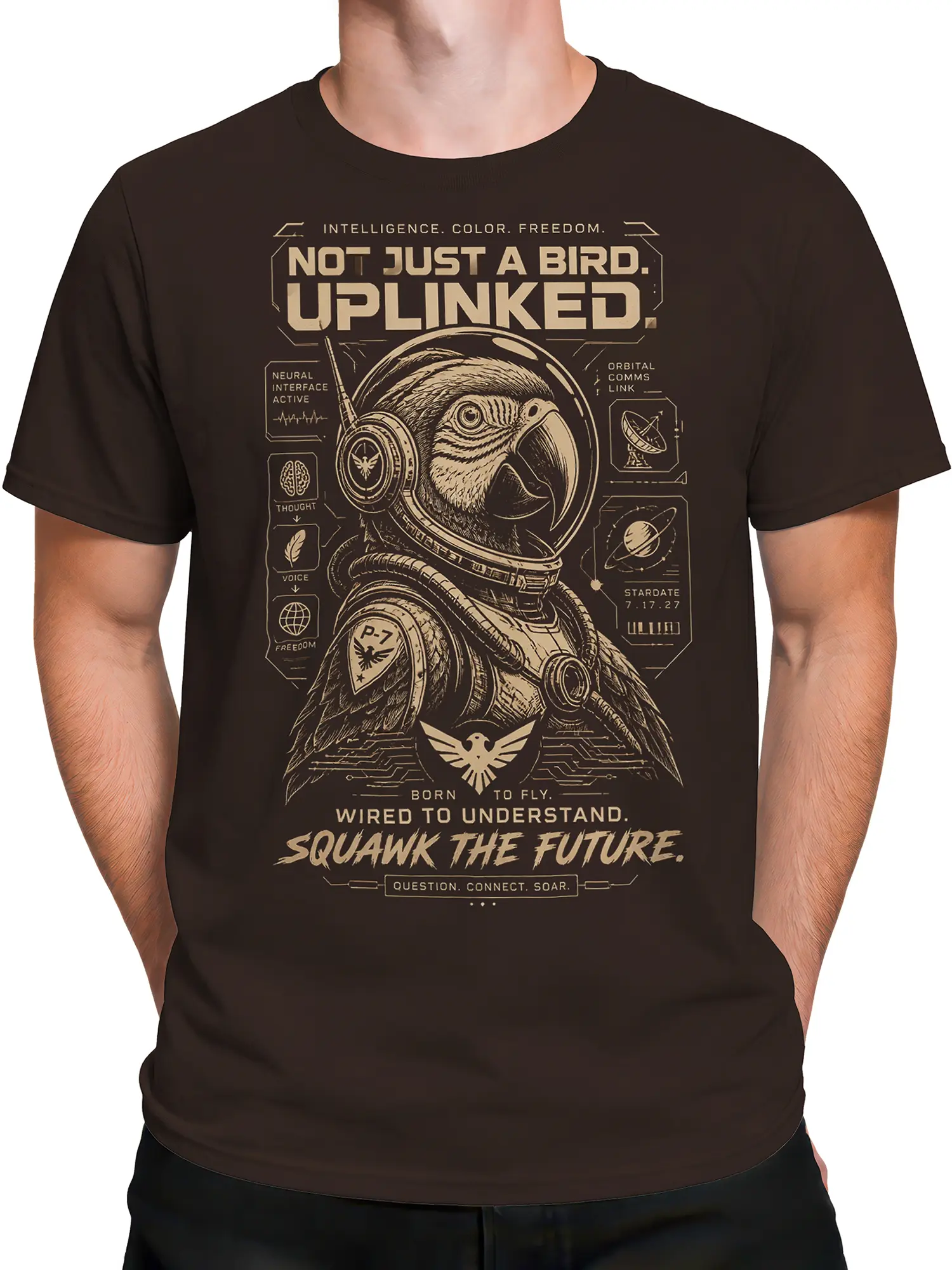 Male torso wearing a brown bird graphic shirt with a space helmet, orbital symbols, and futuristic lettering