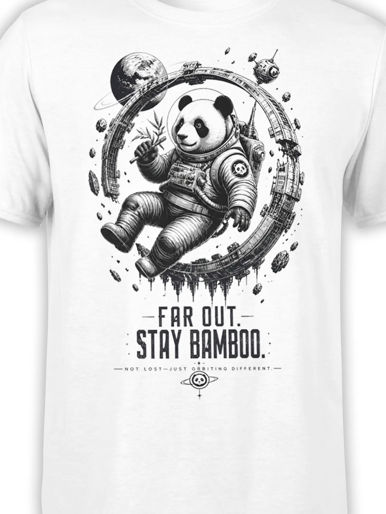 Close-up of the panda astronaut and bamboo design printed on a white T-shirt with planets and orbital details