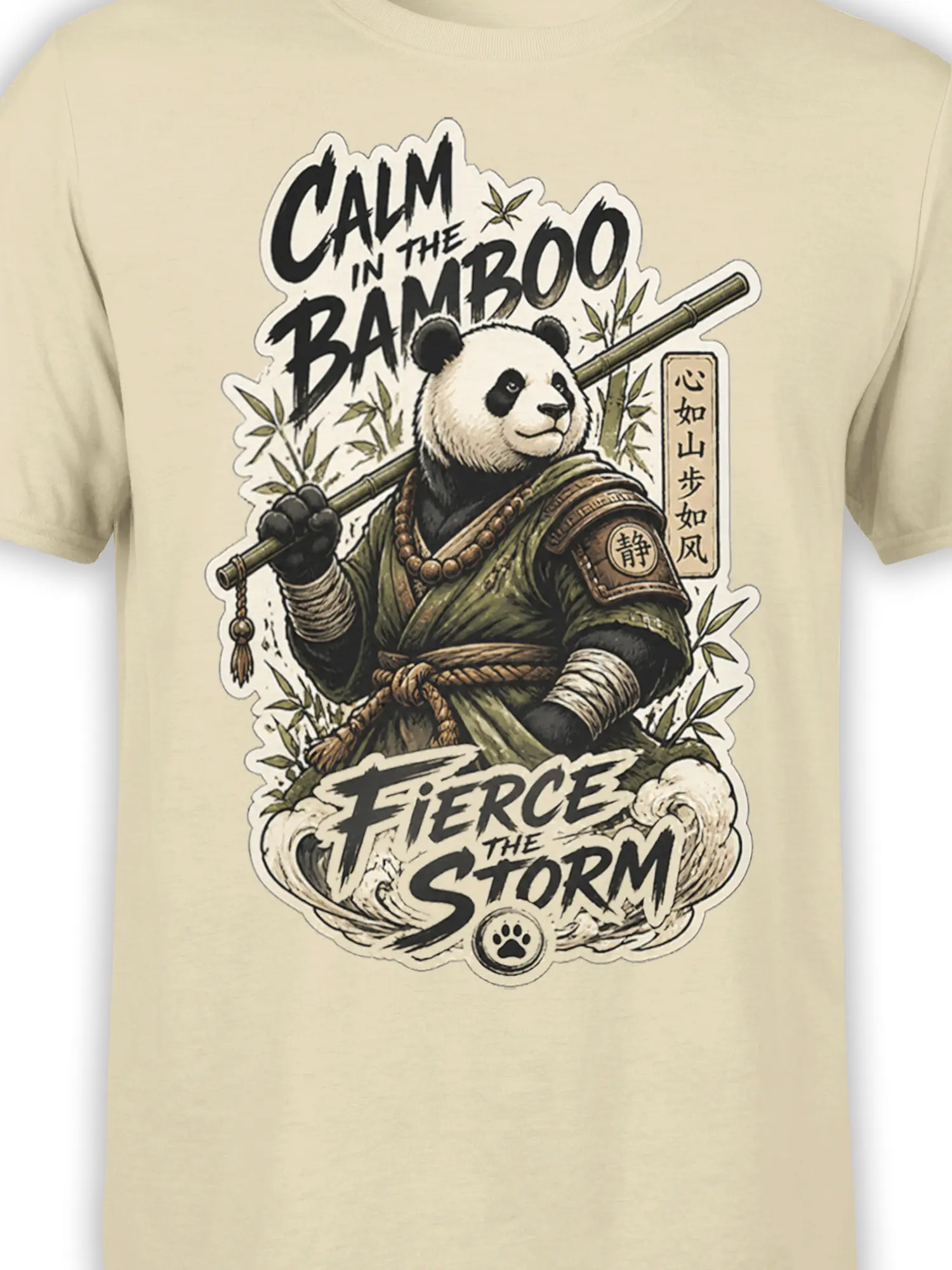 Close-up of panda warrior artwork with bamboo staff, storm waves, paw symbol, and brush lettering on a beige shirt