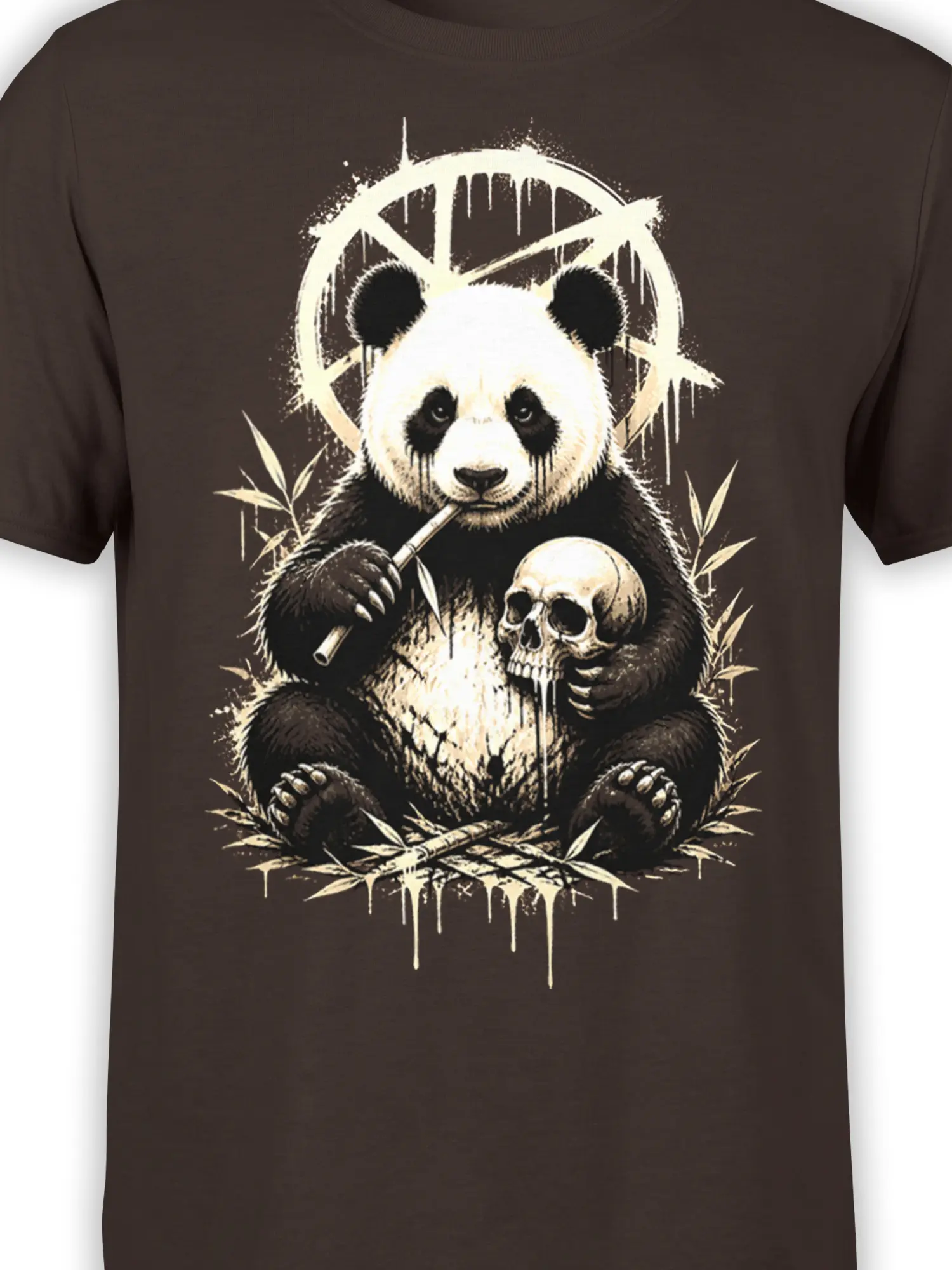 Close-up of panda, bamboo, skull, and circular symbol in cream artwork on a brown shirt