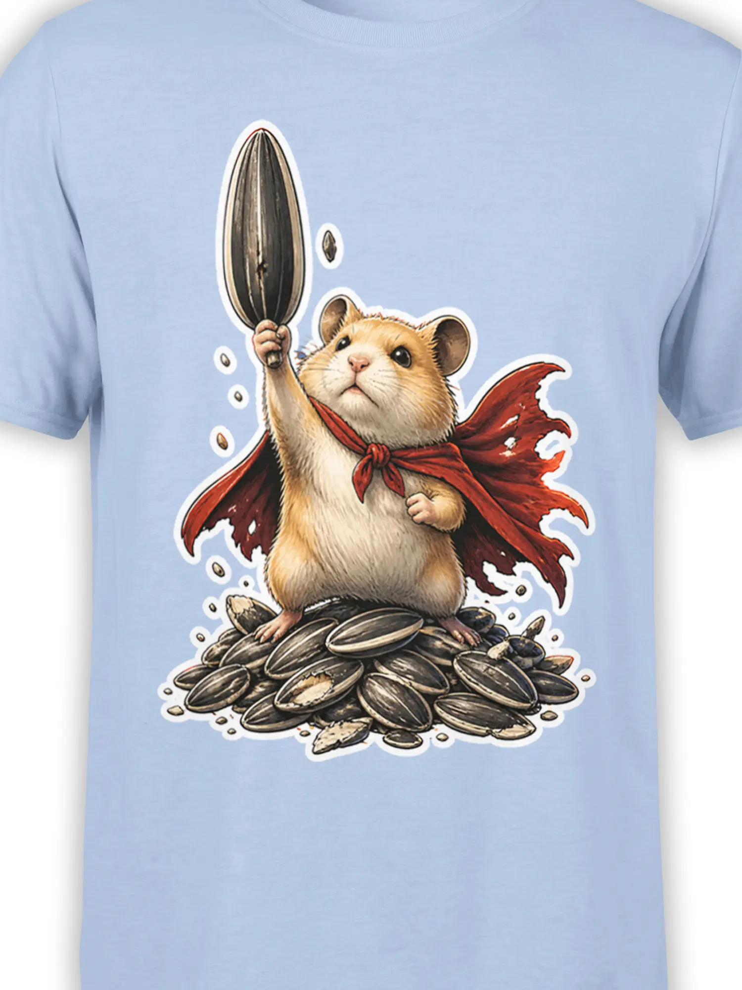 Close-up of caped hamster artwork with sunflower seeds on a light blue graphic T-shirt