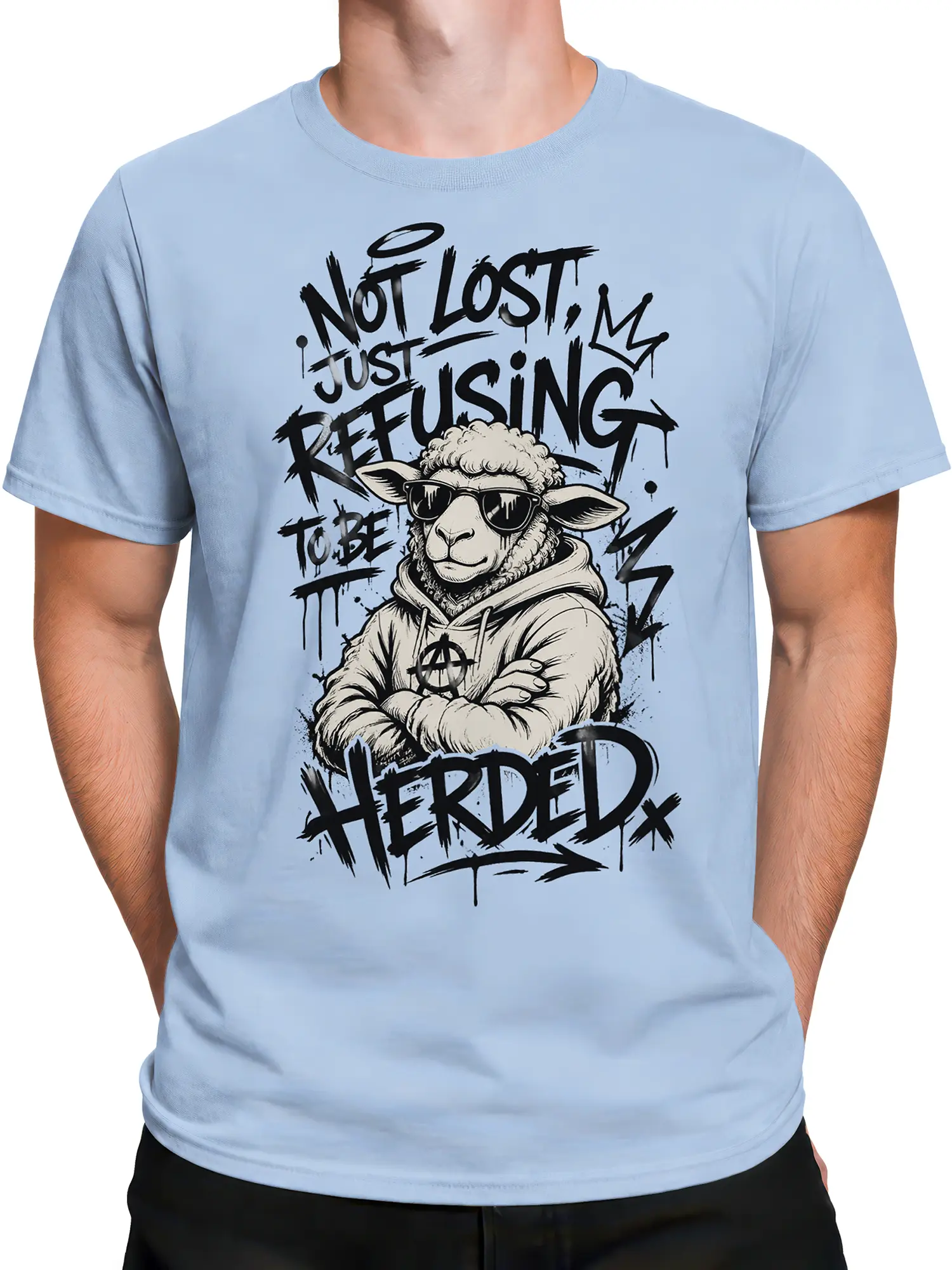 Male torso wearing a light blue rebellious sheep T-shirt with graffiti-style lettering