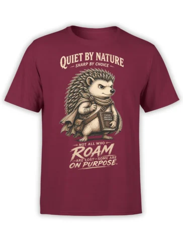 Storybook hedgehog adventurer graphic with a cape, satchel, and focus message on a burgundy T-shirt