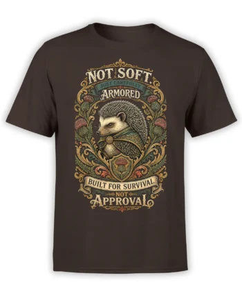 Armored hedgehog crest with thistles and “Not Soft” survival lettering on a brown T-shirt