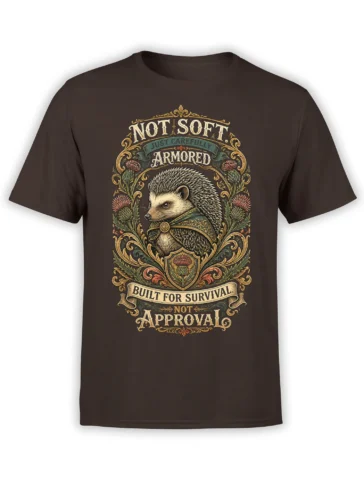 Armored hedgehog crest with thistles and “Not Soft” survival lettering on a brown T-shirt