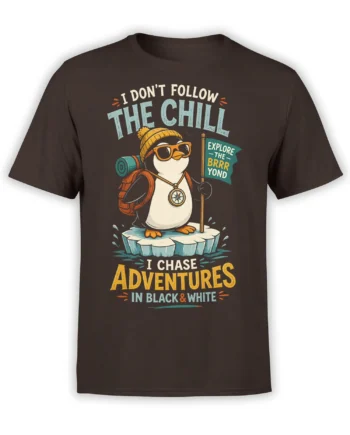 Vintage penguin explorer graphic on a brown shirt with backpack, compass, ice floe, and adventure lettering