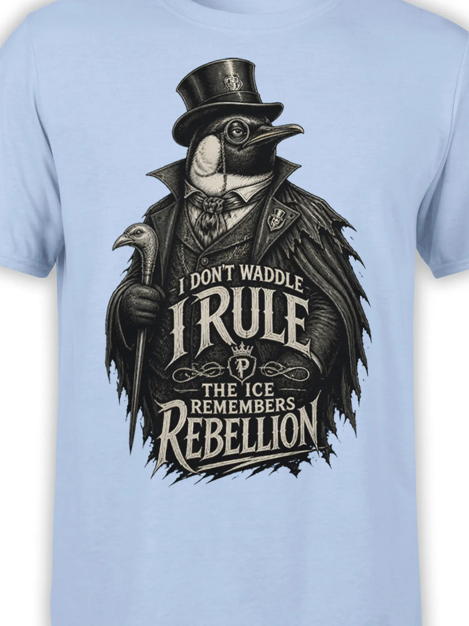 Close-up of the top-hatted penguin, cane, Victorian coat, and rebellion lettering on a light blue shirt