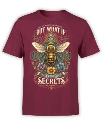 Mysterious bee graphic with an eye symbol, flowers, and secret-themed lettering on a burgundy T-shirt