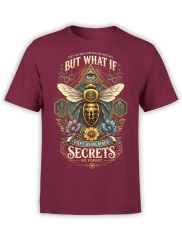 Mysterious bee graphic with an eye symbol, flowers, and secret-themed lettering on a burgundy T-shirt