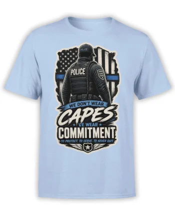 Light blue police T-shirt with officer, American flag, blue line, badge, and commitment message