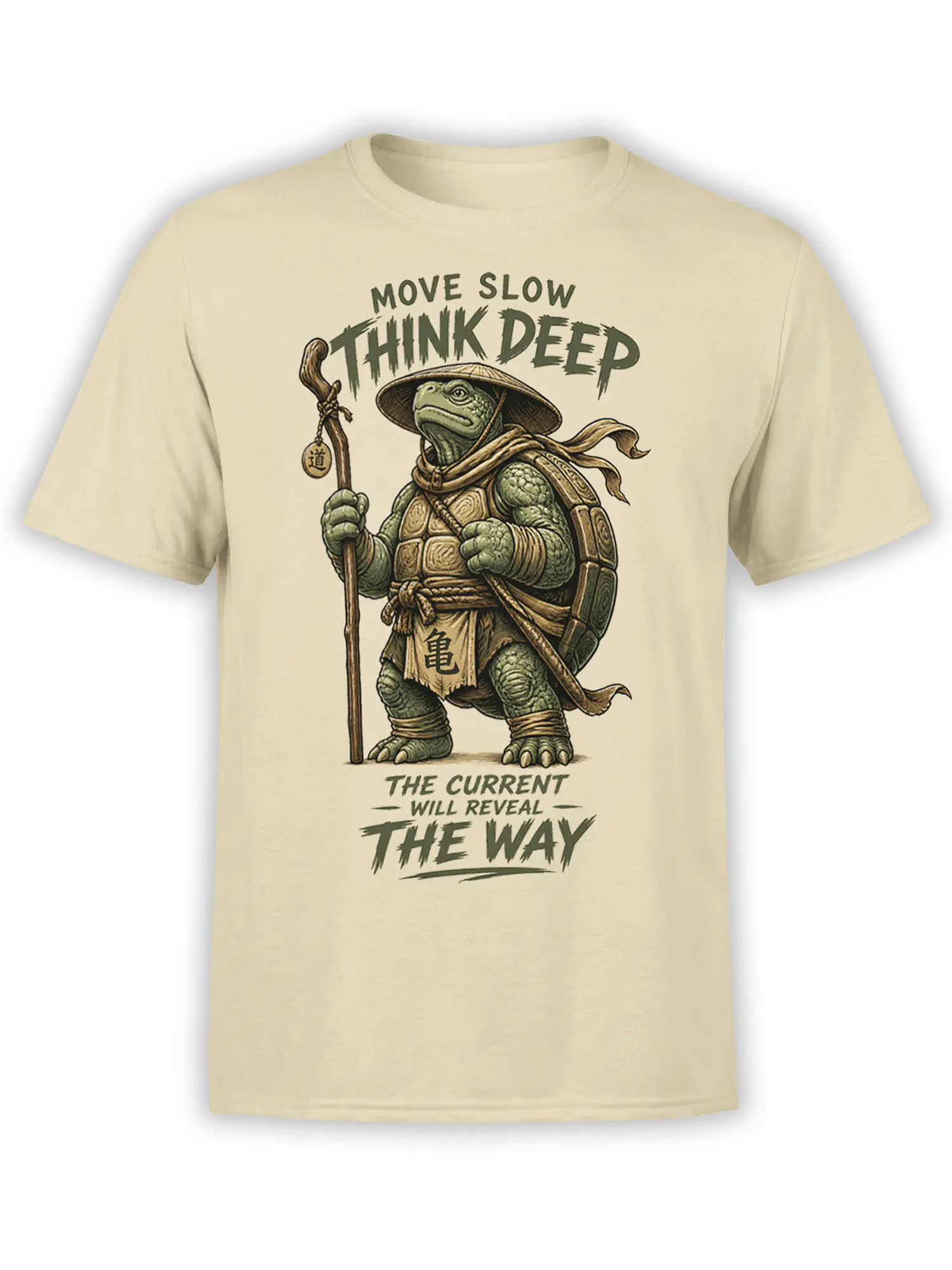 Thoughtful green turtle traveler with staff and slow-living message on a beige graphic T-shirt