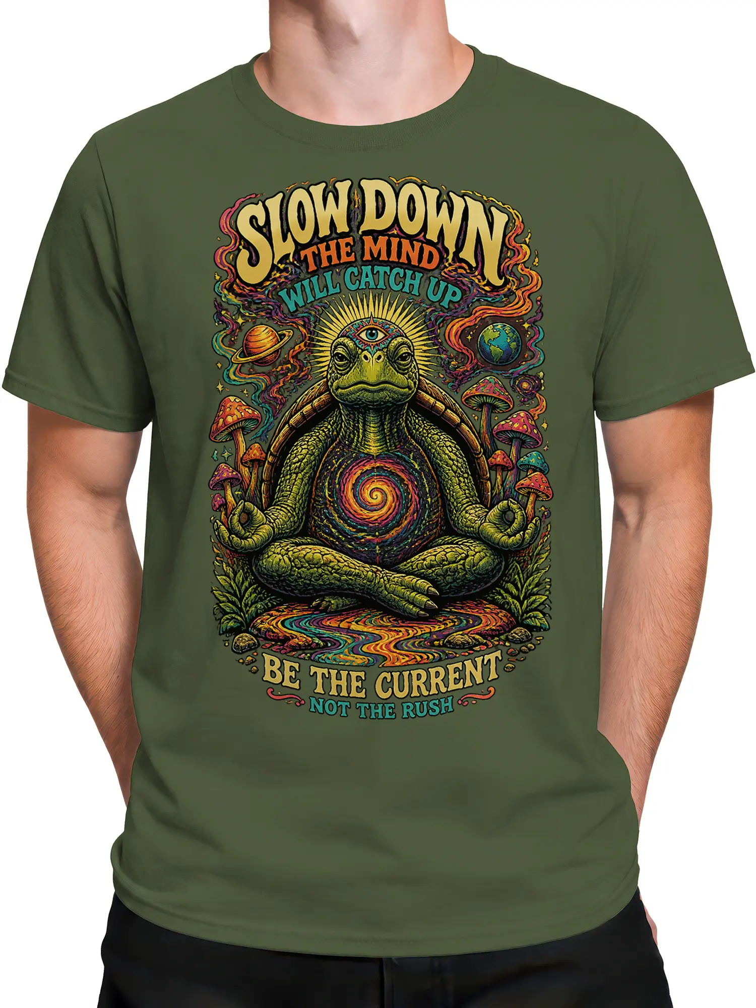 Male torso wearing an olive green turtle graphic T-shirt with cosmic mushrooms and slow-living text