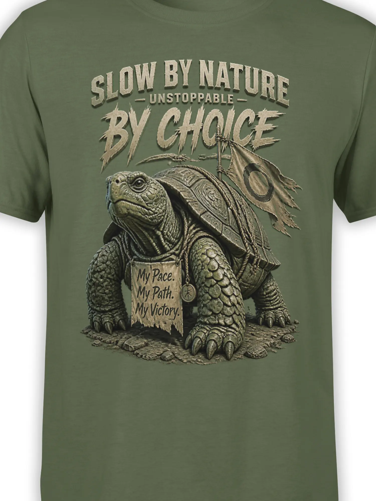 Close-up of the turtle, shell details, banner, and motivational lettering on the green graphic tee