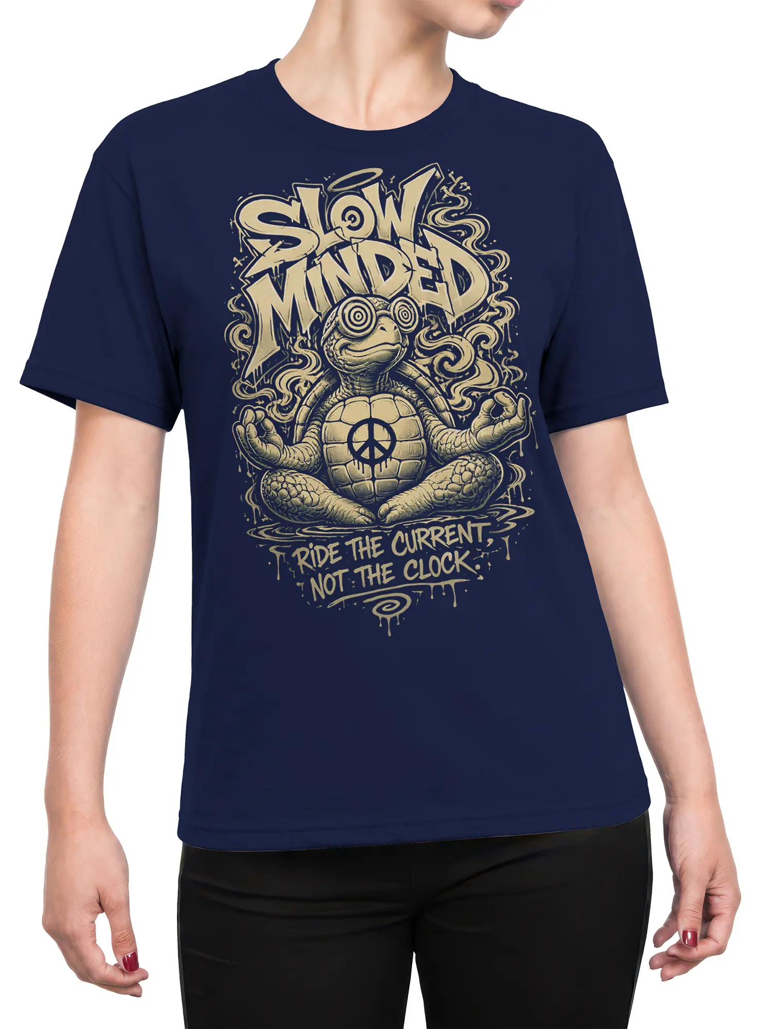 Female torso wearing a navy T-shirt with a meditating turtle, peace symbol, and slow-living graphic