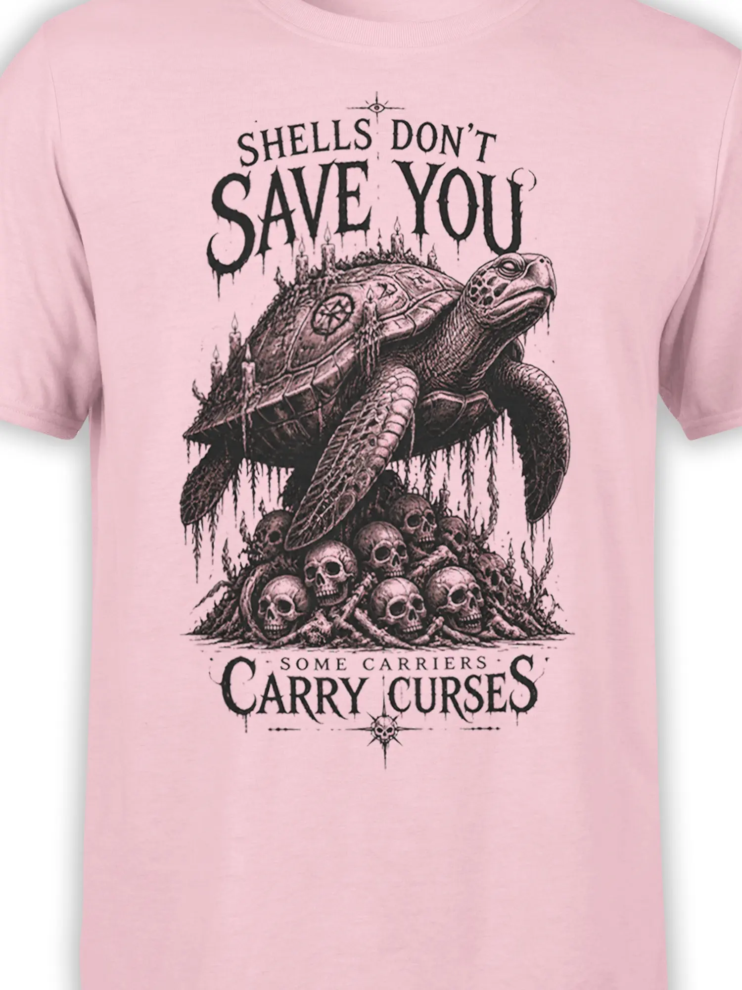 Close-up of the gothic turtle shell, skulls, candle details, and black lettering on the pink T-shirt