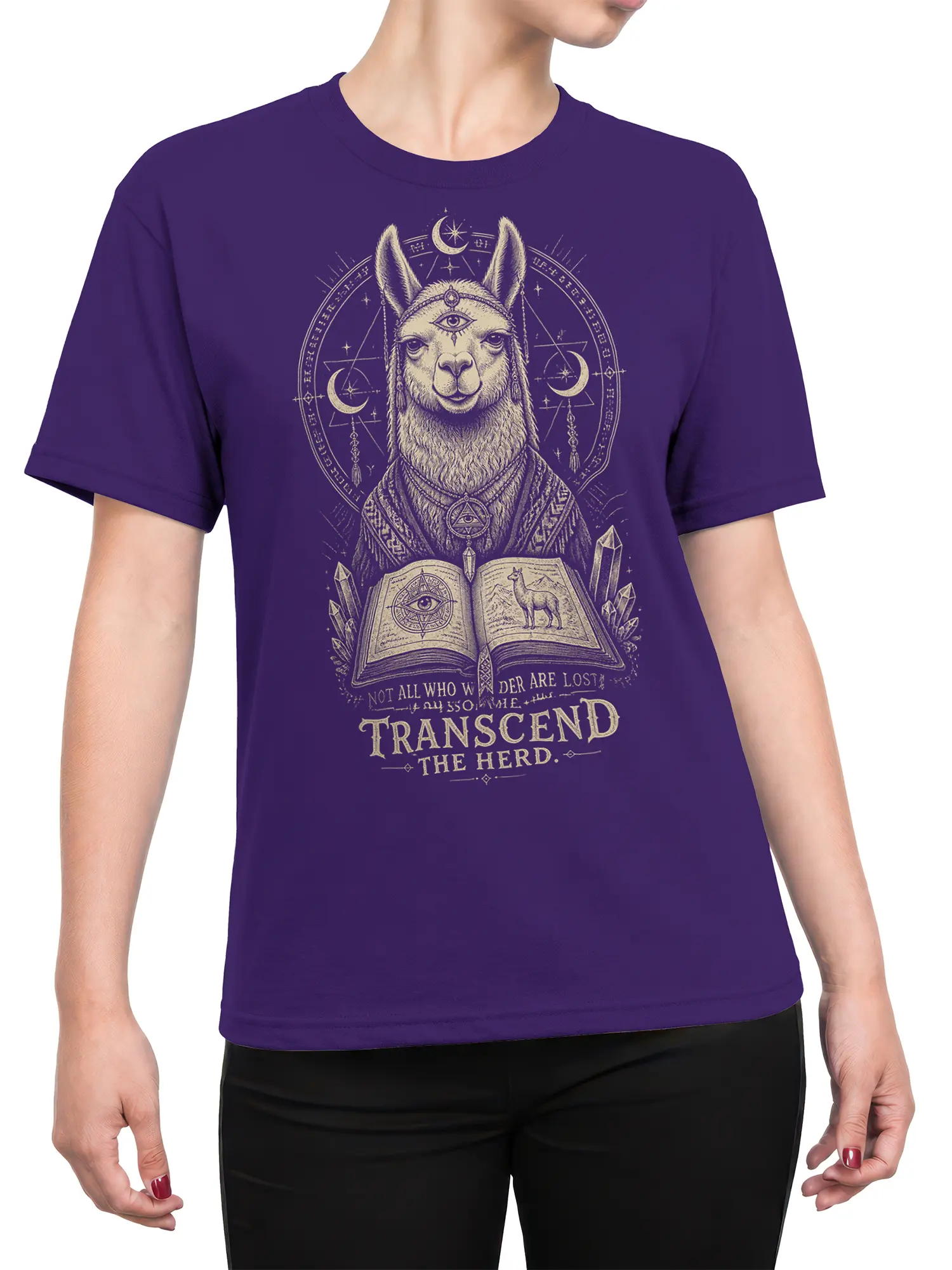 Female torso wearing a purple mystical llama T-shirt with moons, crystals, an open book, and Transcend the Herd artwork