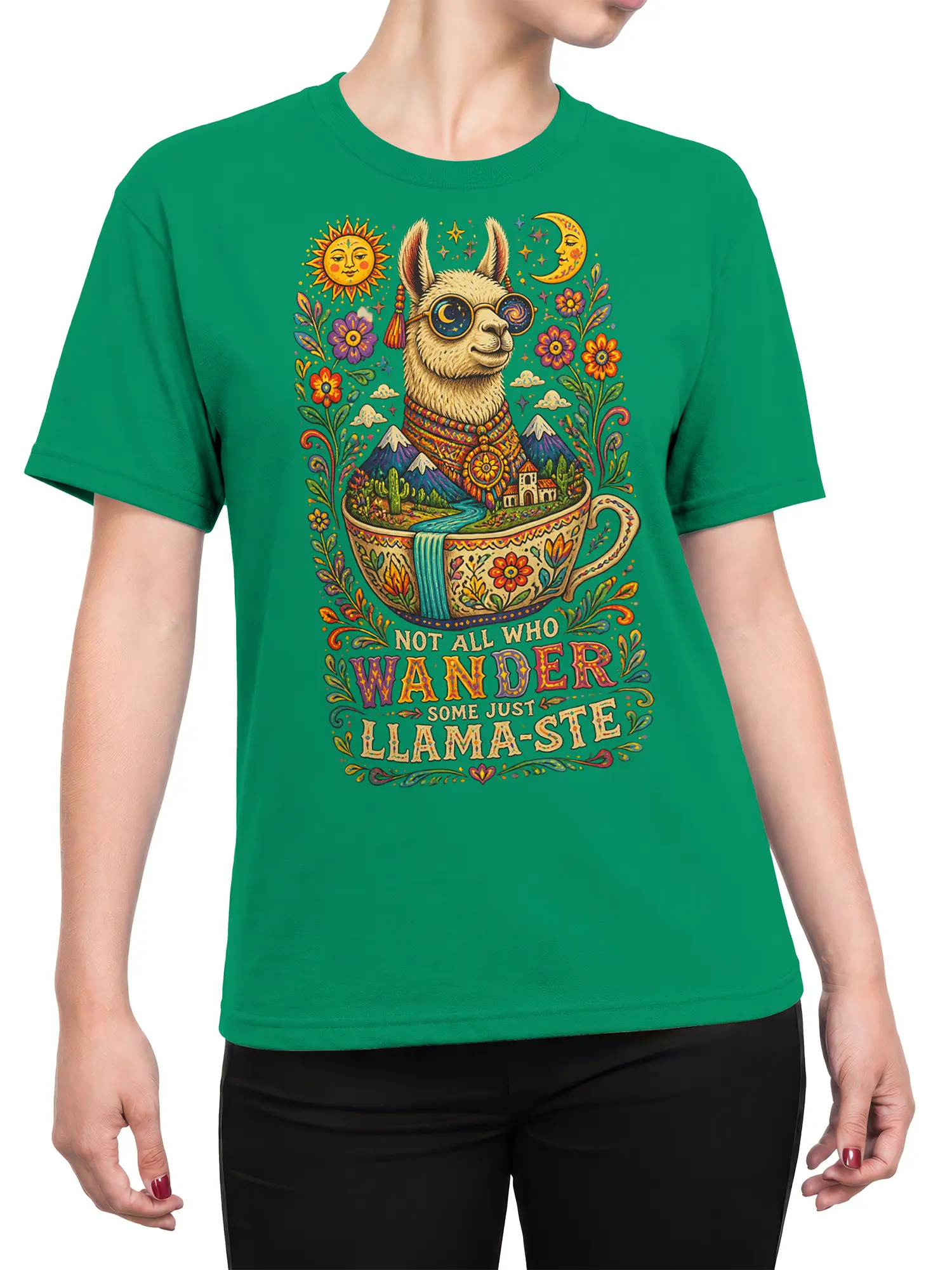 Female torso wearing a green llama T-shirt with colorful folk-art scenery, celestial glasses, flowers, mountains, and wanderer text