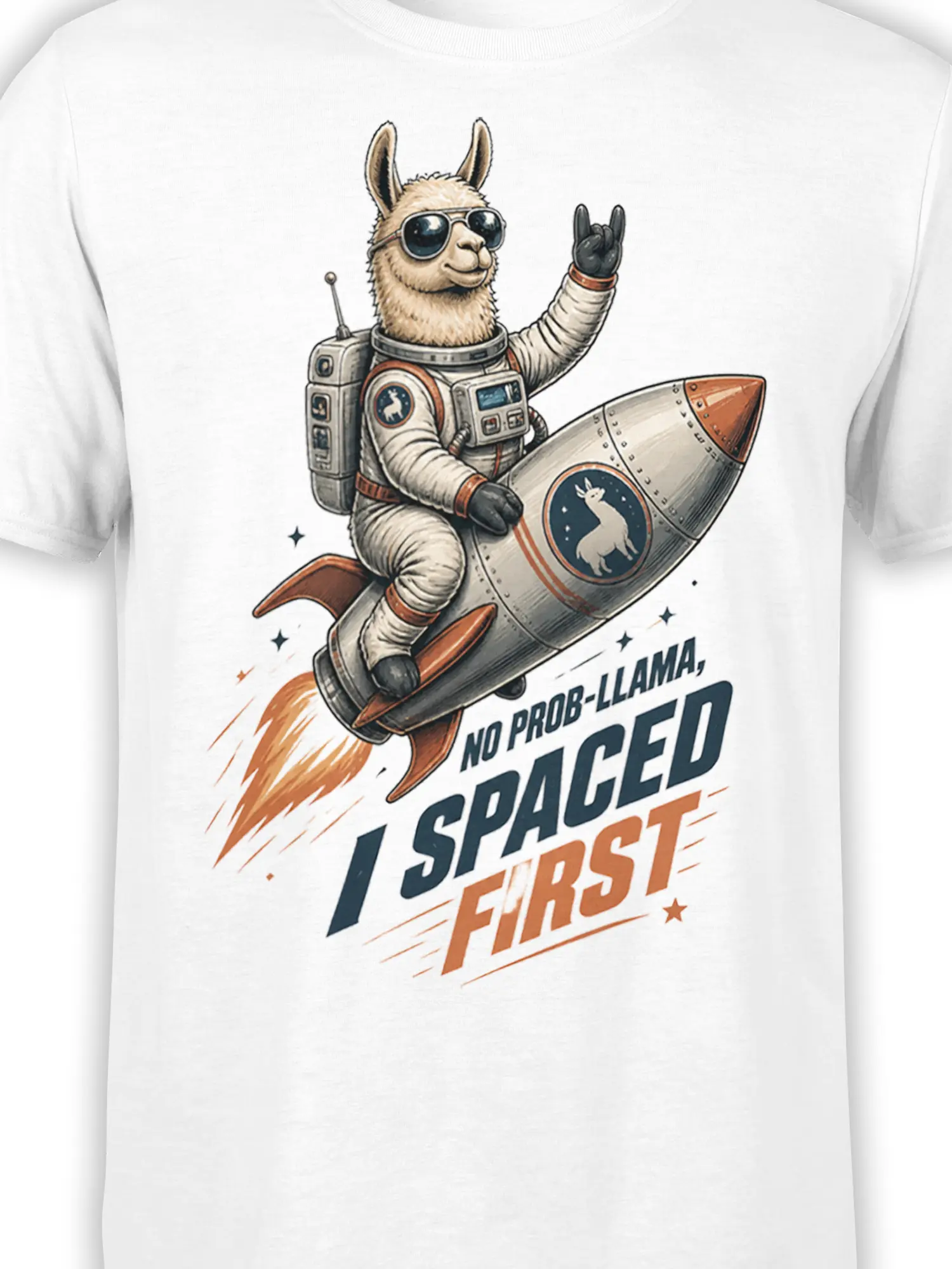 Close-up of astronaut llama artwork, rocket details, stars, and bold lettering on a white graphic T-shirt