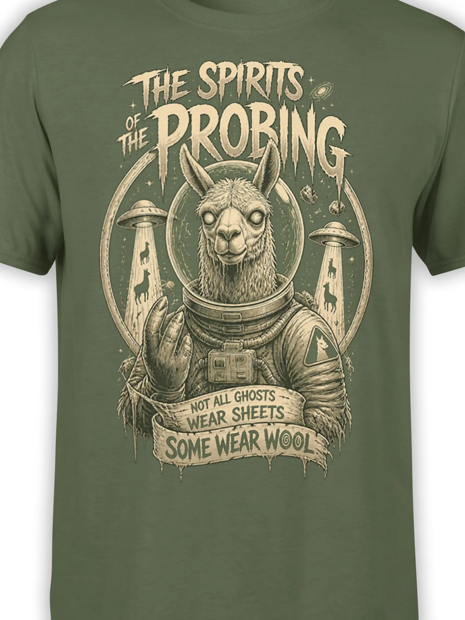 Close-up of astronaut llama artwork, UFOs, and wool humor lettering on an olive green T-shirt