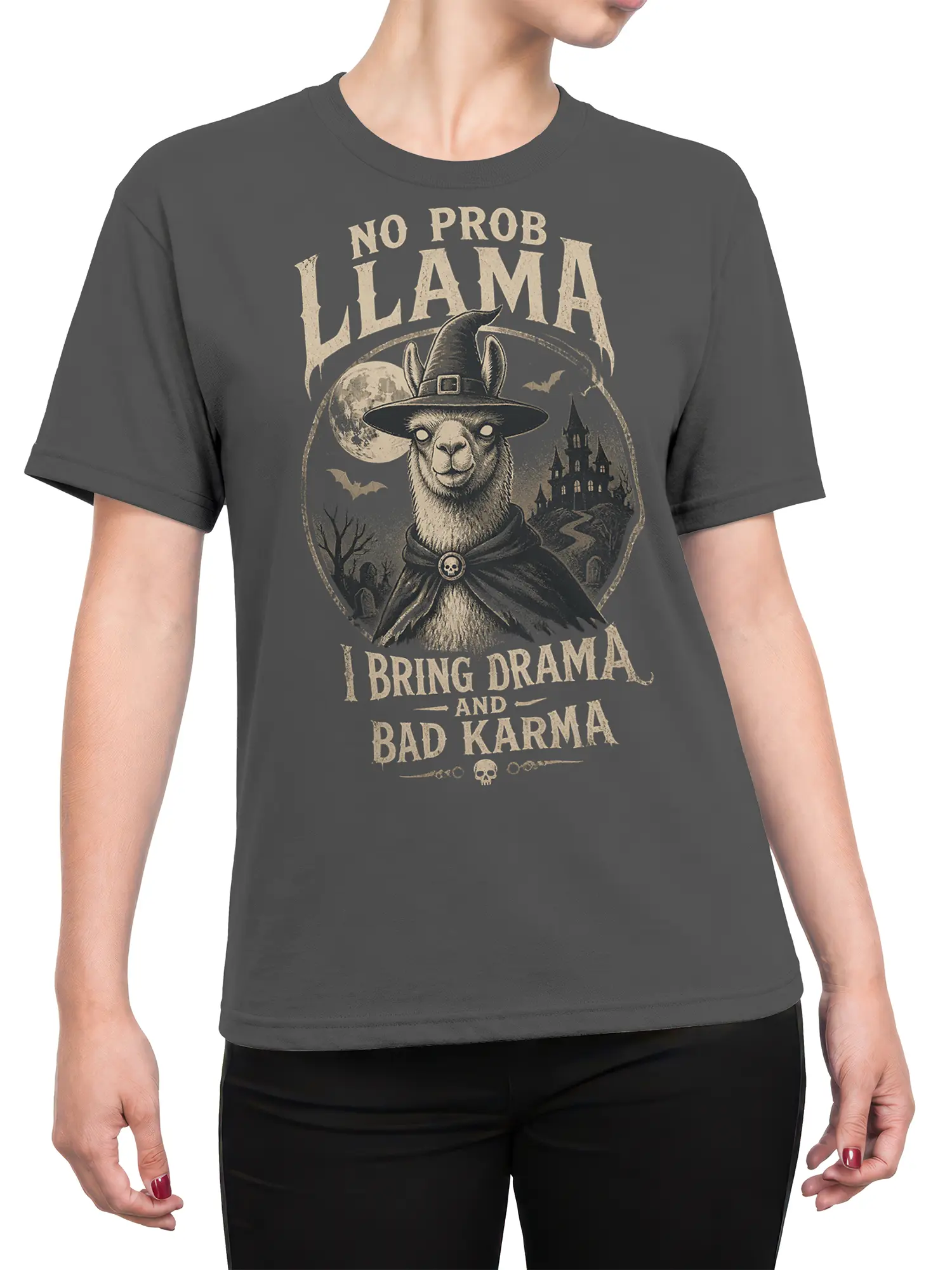 Female torso wearing a gray witch llama T-shirt with haunted castle and bad karma graphic