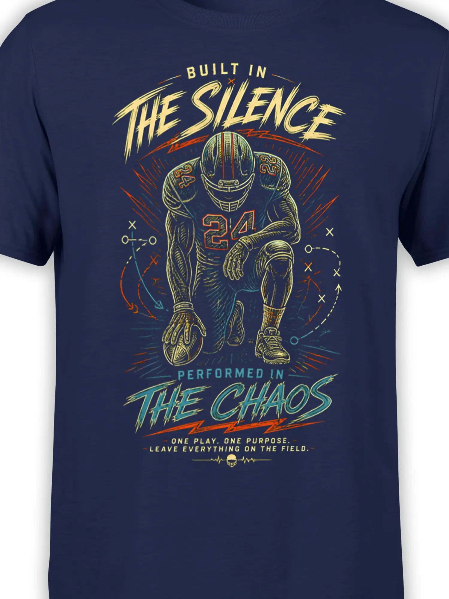 Close-up of the number 24 football player graphic, play arrows, and silence to chaos lettering on navy fabric