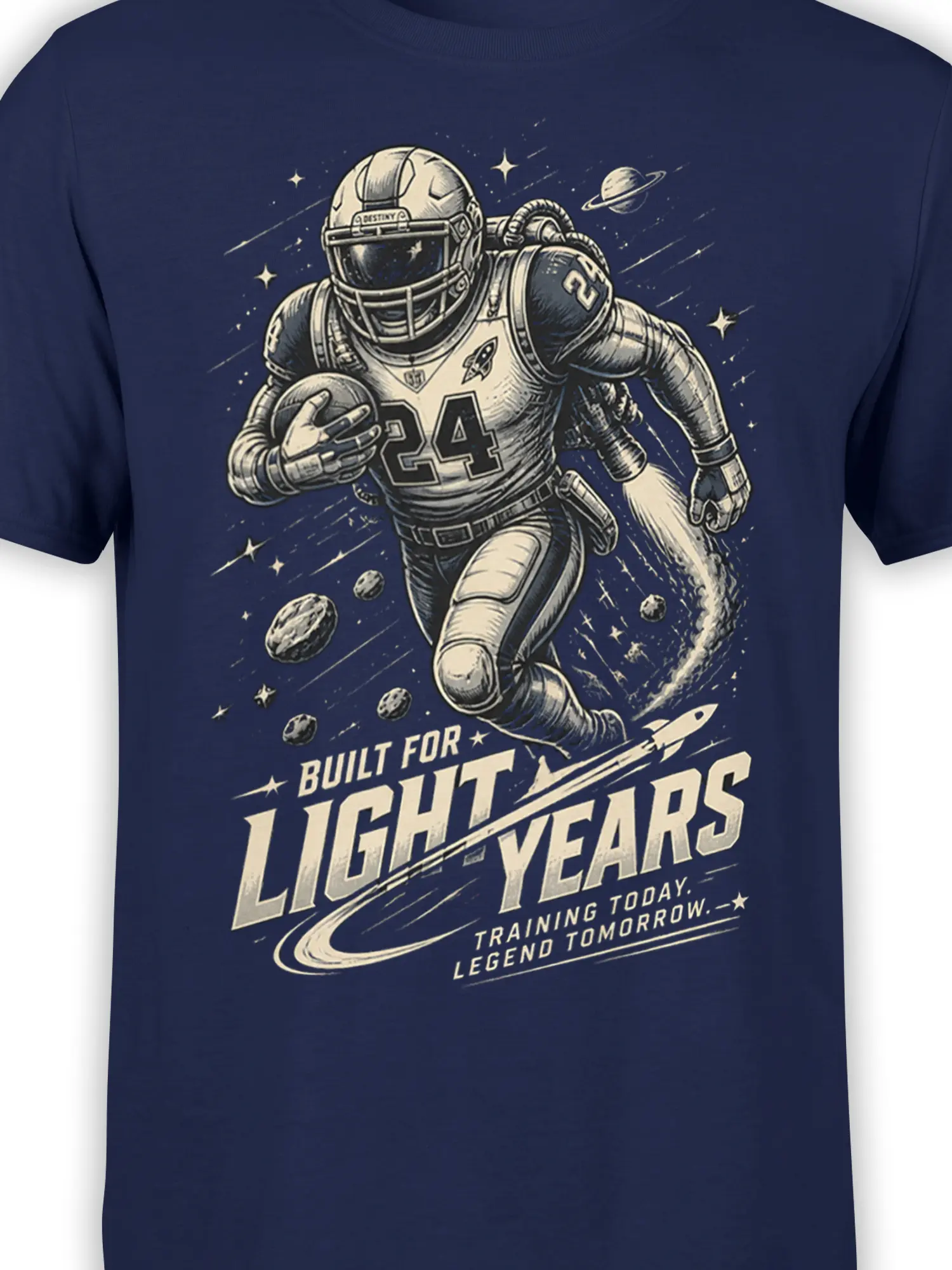 Close-up of astronaut number 24 graphic with rocket, planets, stars, and light-years text on navy fabric