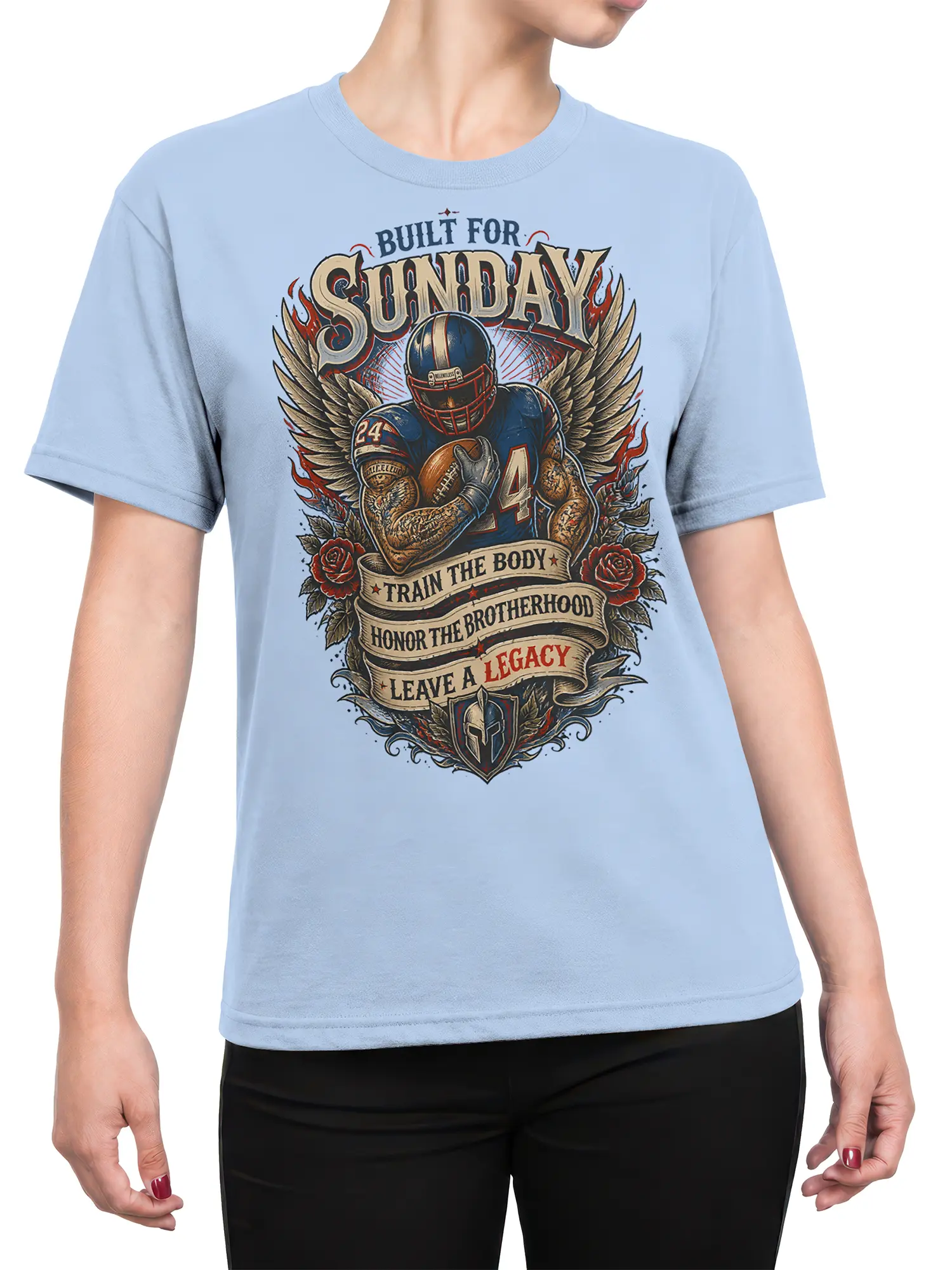 Female torso wearing a light blue Sunday Legacy football T-shirt with winged player and vintage sports artwork
