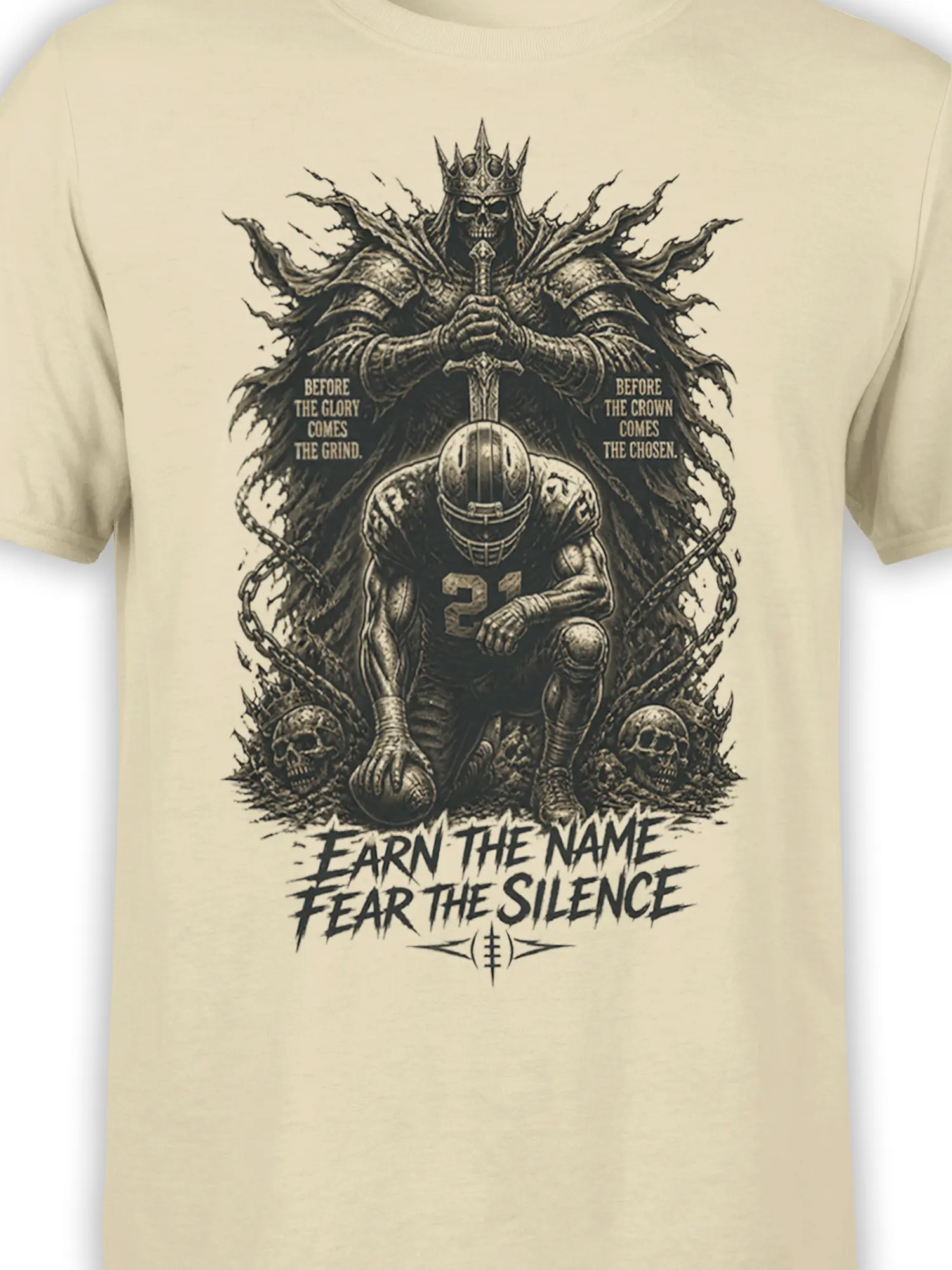 Close-up of crowned skeleton king and armored football player artwork on a beige football T-shirt