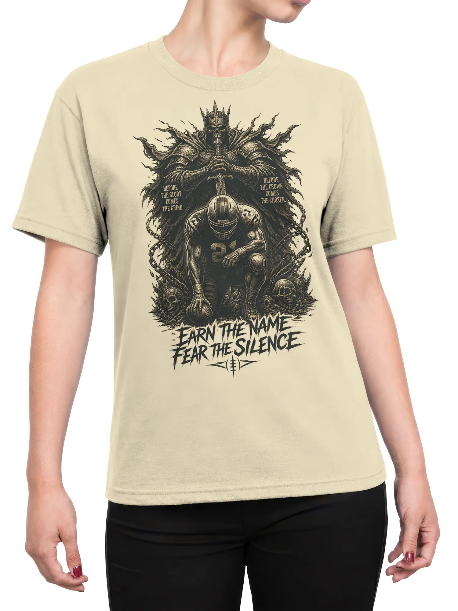 Female torso wearing a beige T-shirt with armored football player and crowned skeleton king design