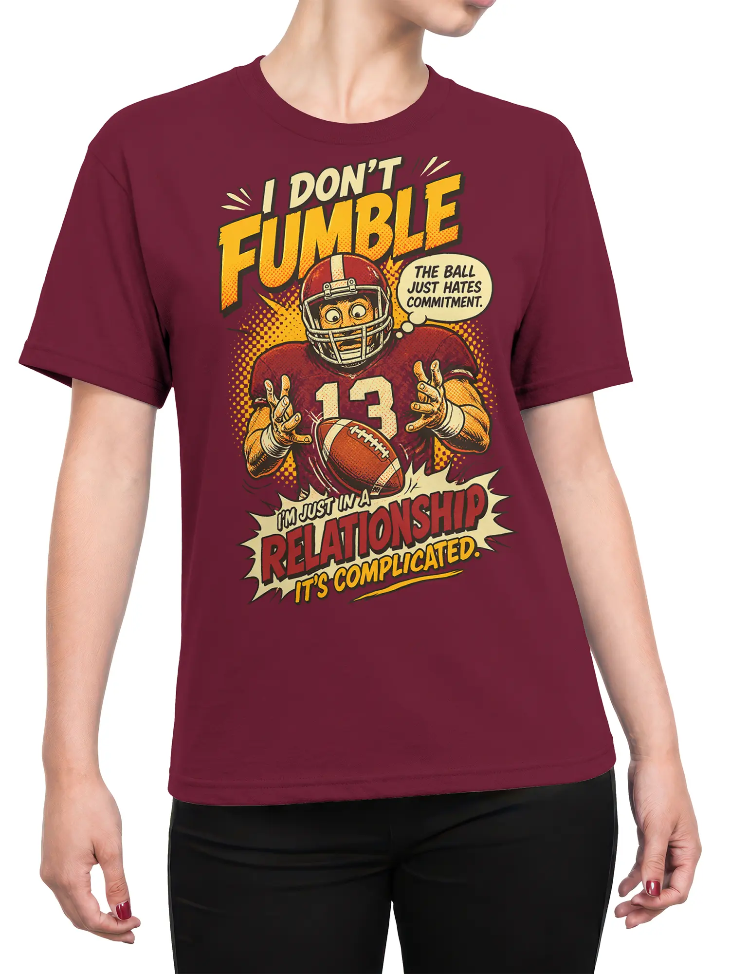 Female torso wearing a burgundy football t-shirt with vintage number 13 commitment issues artwork