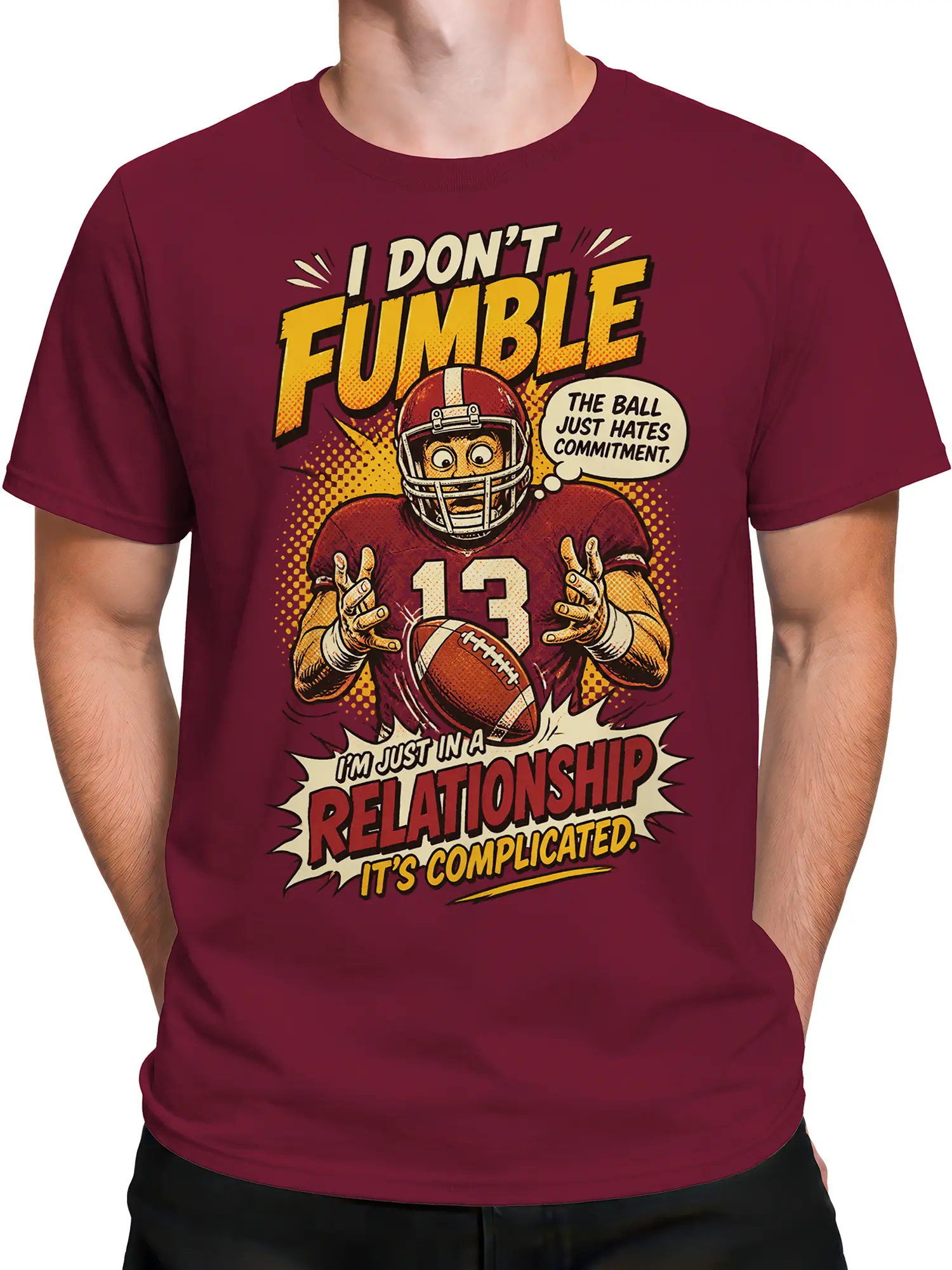 Male torso wearing a burgundy football t-shirt with number 13 and vintage comic artwork