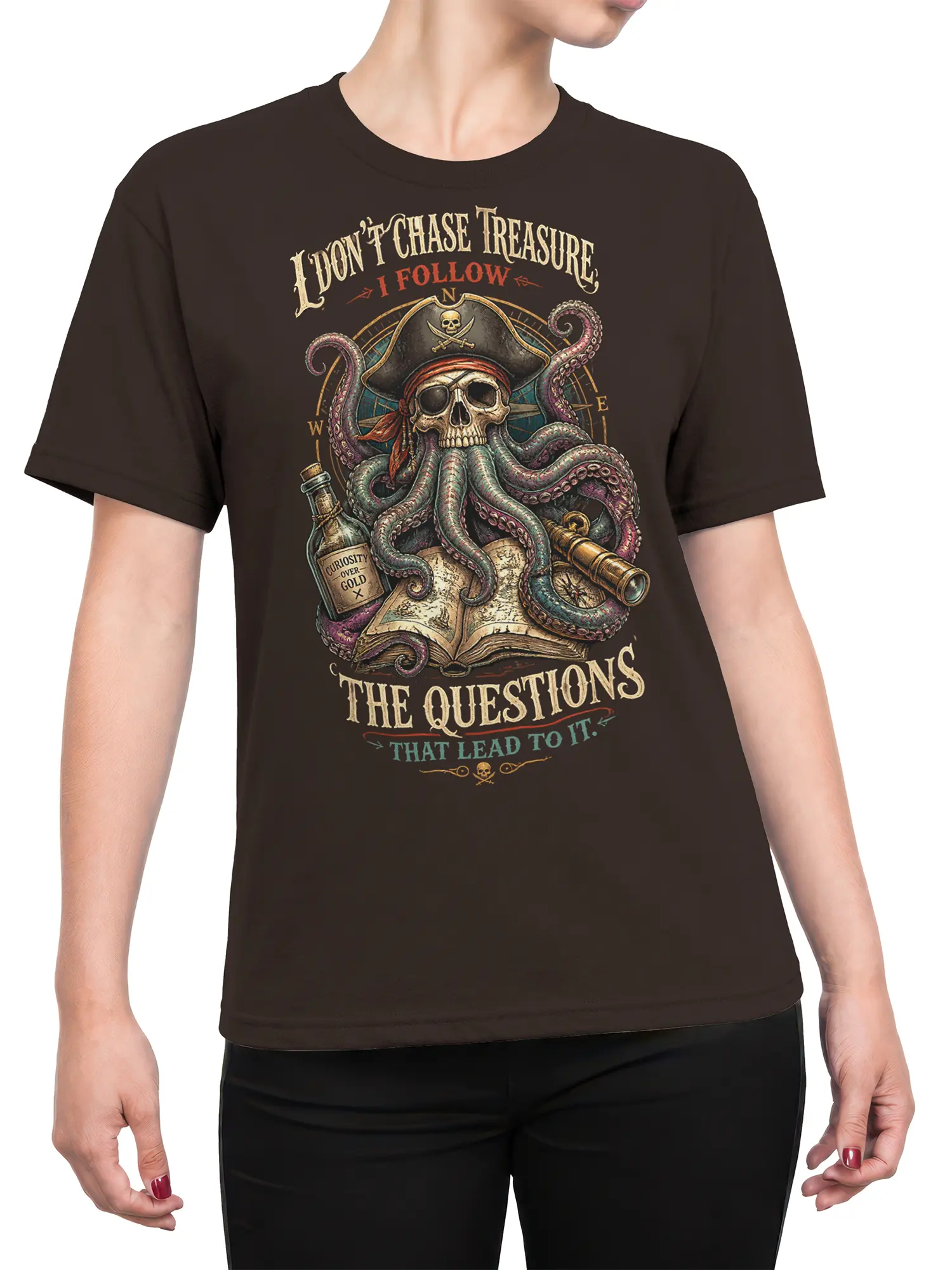 Female torso wearing a brown pirate T-shirt with a skull octopus, map, and vintage nautical slogan