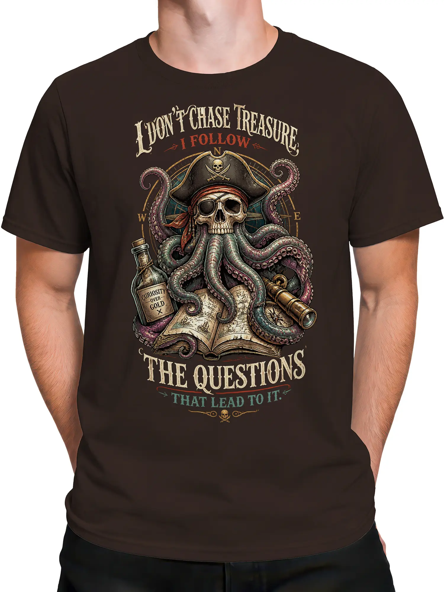 Male torso wearing a brown pirate T-shirt with a skull octopus and treasure map artwork