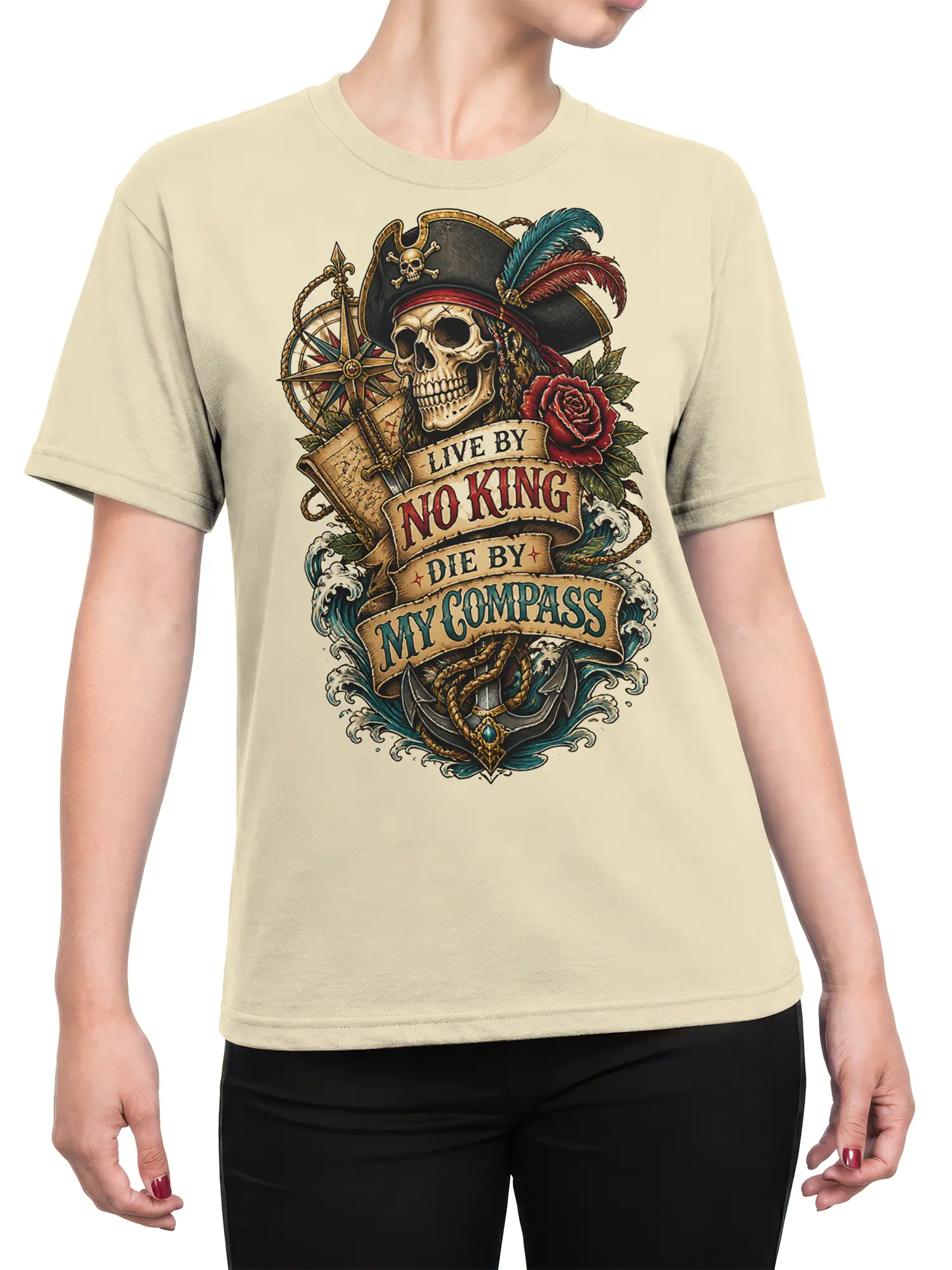 Female torso wearing a beige pirate skull T-shirt with compass, anchor, waves, rose, and vintage nautical artwork