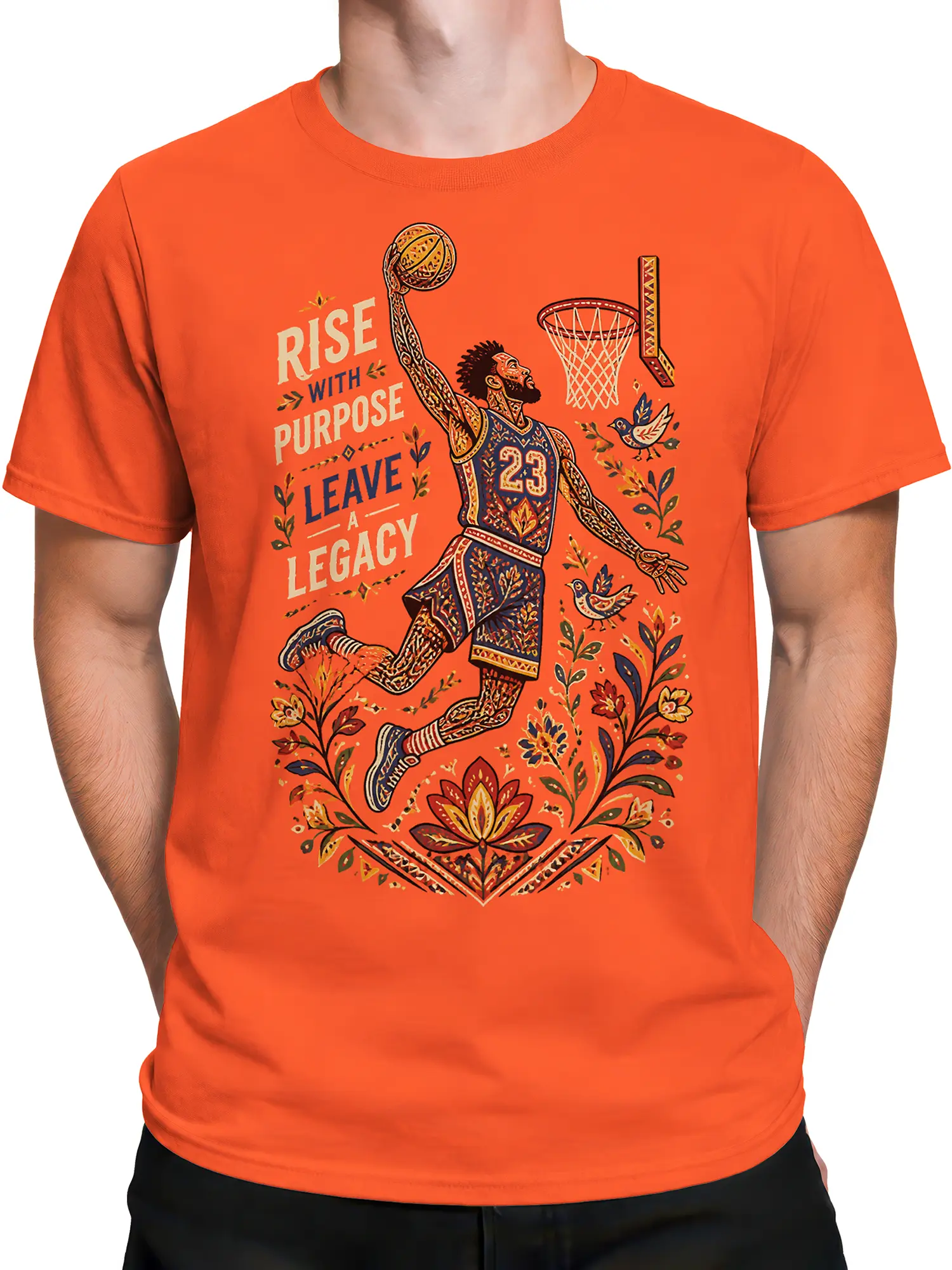 Male torso wearing an orange basketball T-shirt with ornate player, floral, bird, and legacy design