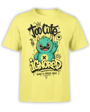 Yellow T-shirt with a teal horned monster, bold graffiti lettering, and a Too Cute to Be Ignored design