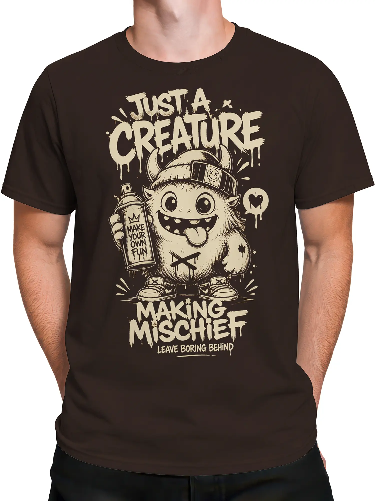 Male torso wearing brown monster T-shirt with “Making Mischief” creature design