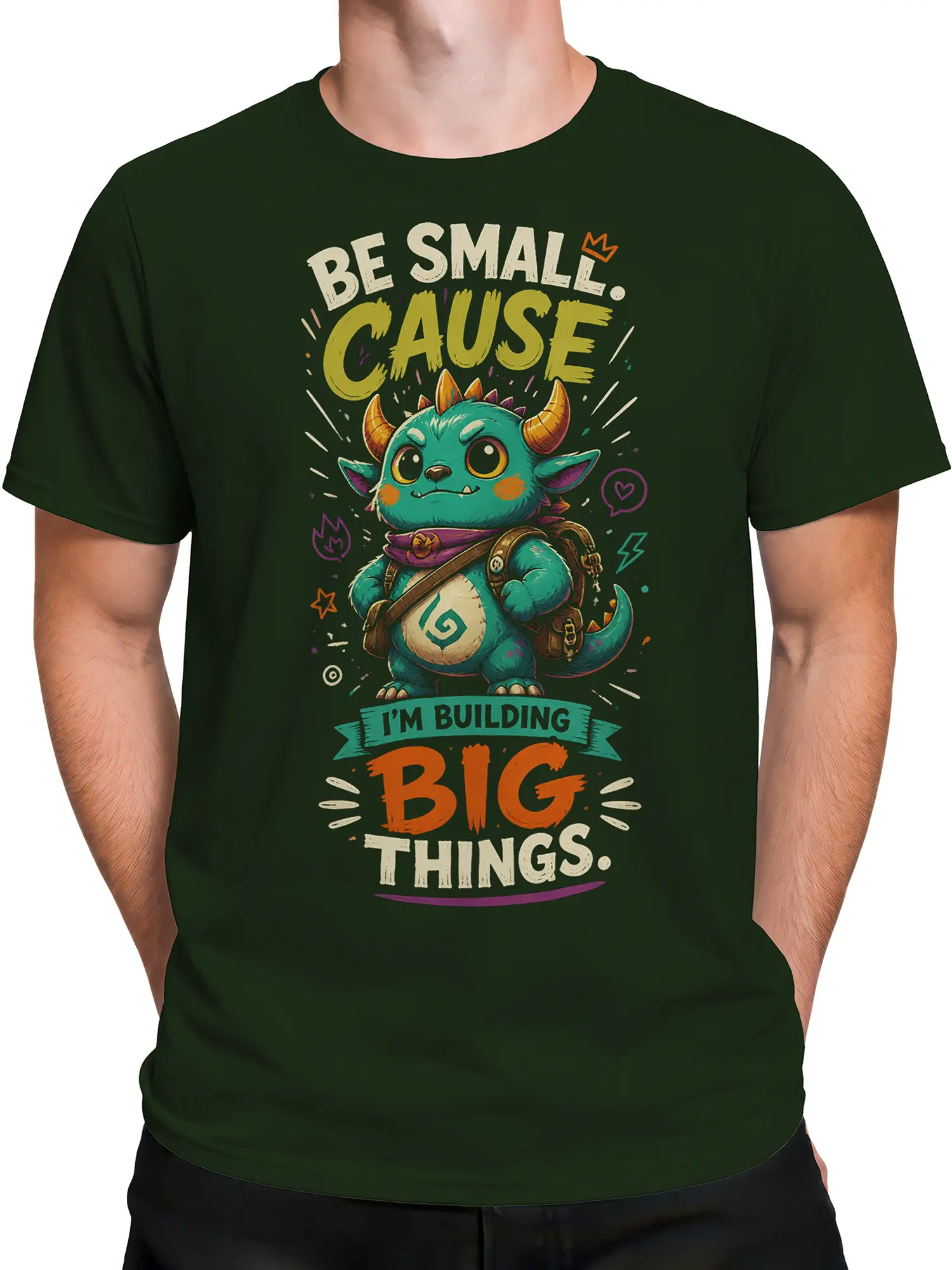 Male torso wearing a dark green fantasy T-shirt with a turquoise horned creature and colorful graphic design
