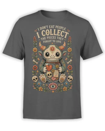 Gray T-shirt with a wide-eyed horned creature, flower frame, bones, skulls, and the phrase about forgotten pieces